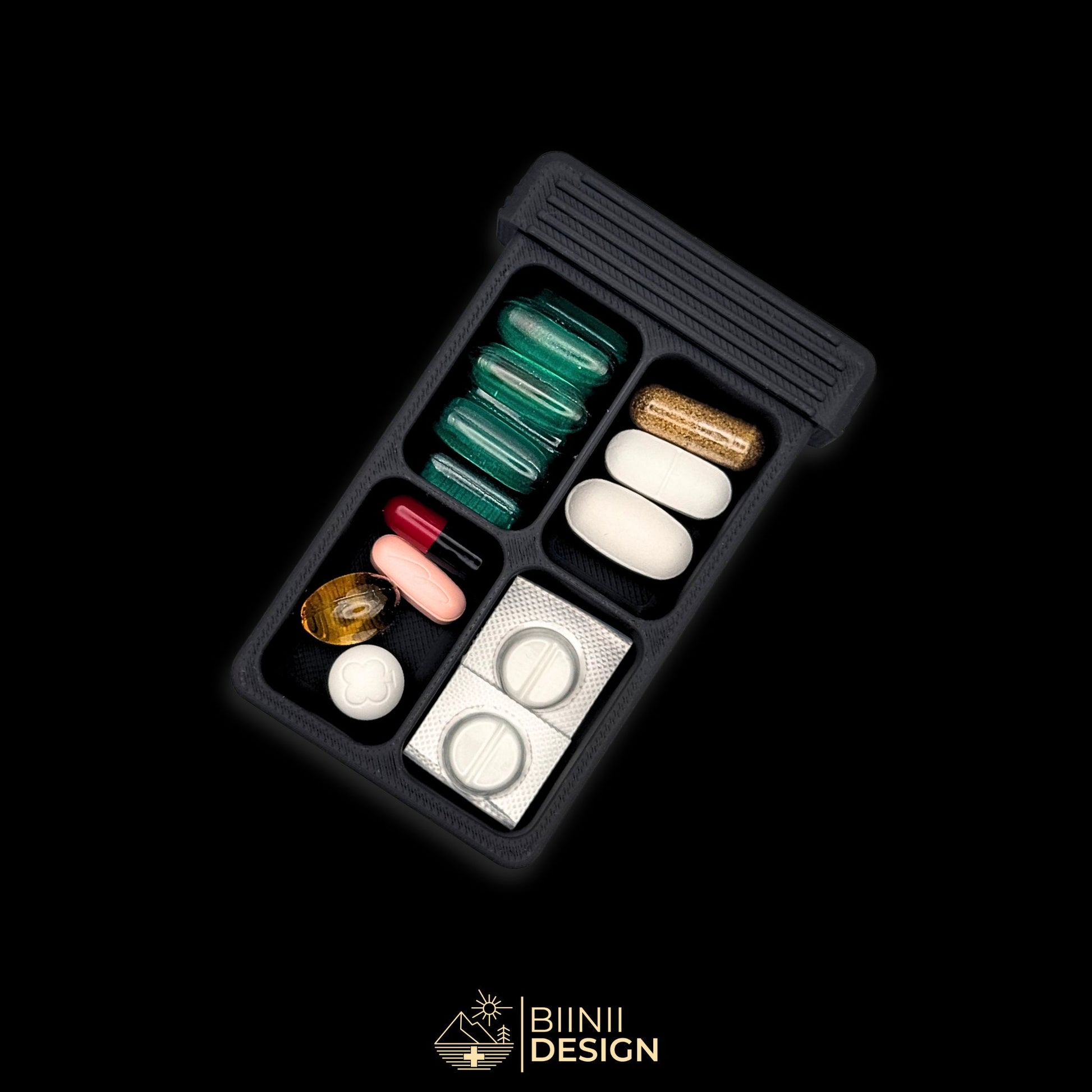 4-compartment artistic pillbox in matte black, compact design for pills, supplements, or daily vitamins.
