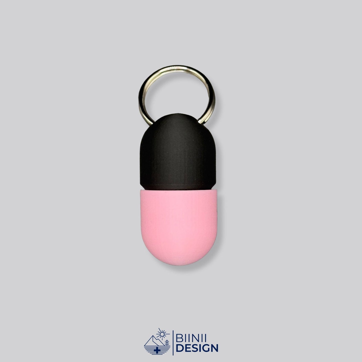Black and pink screw-closed pillbox with keychain. A discreet and compact organizer for daily supplements or medication.
Keywords: pink pill container, compact keyring pillbox, stylish pill holder