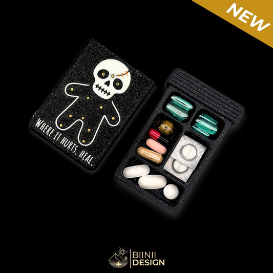 Mystical Healing Voodoo pill organizer open with multiple compartments showing vitamins and daily medication for wellness routines