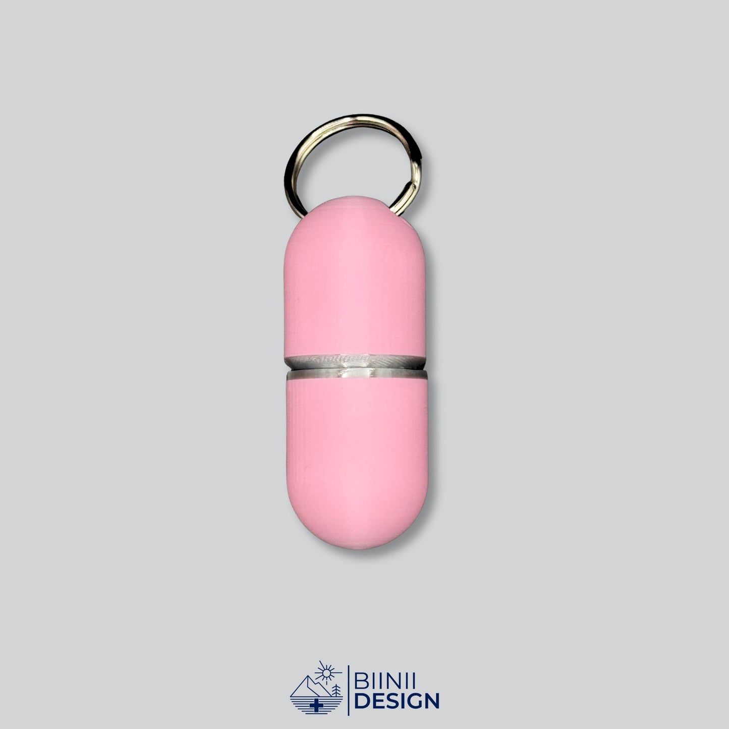 Large keychain pill case deluxe (solid pink, silver ring). Elegant pill container for complex supplement routines.