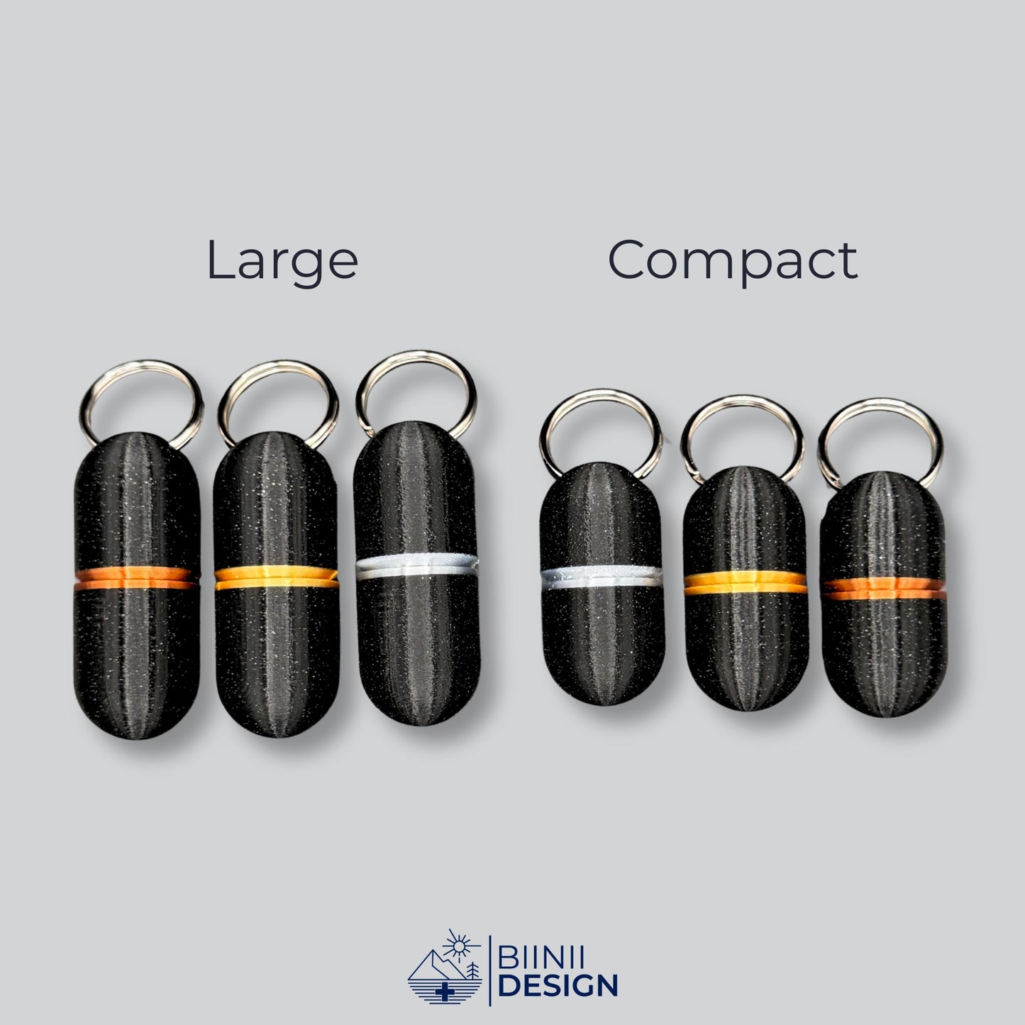 Comparison between large and compact deluxe keyring pillboxes in black galaxy finish with gold, copper, and silver rings. Sleek and practical.
Keywords: deluxe pill organizer, keychain pill case, minimalist pill holder, travel meds container, Biinii Design