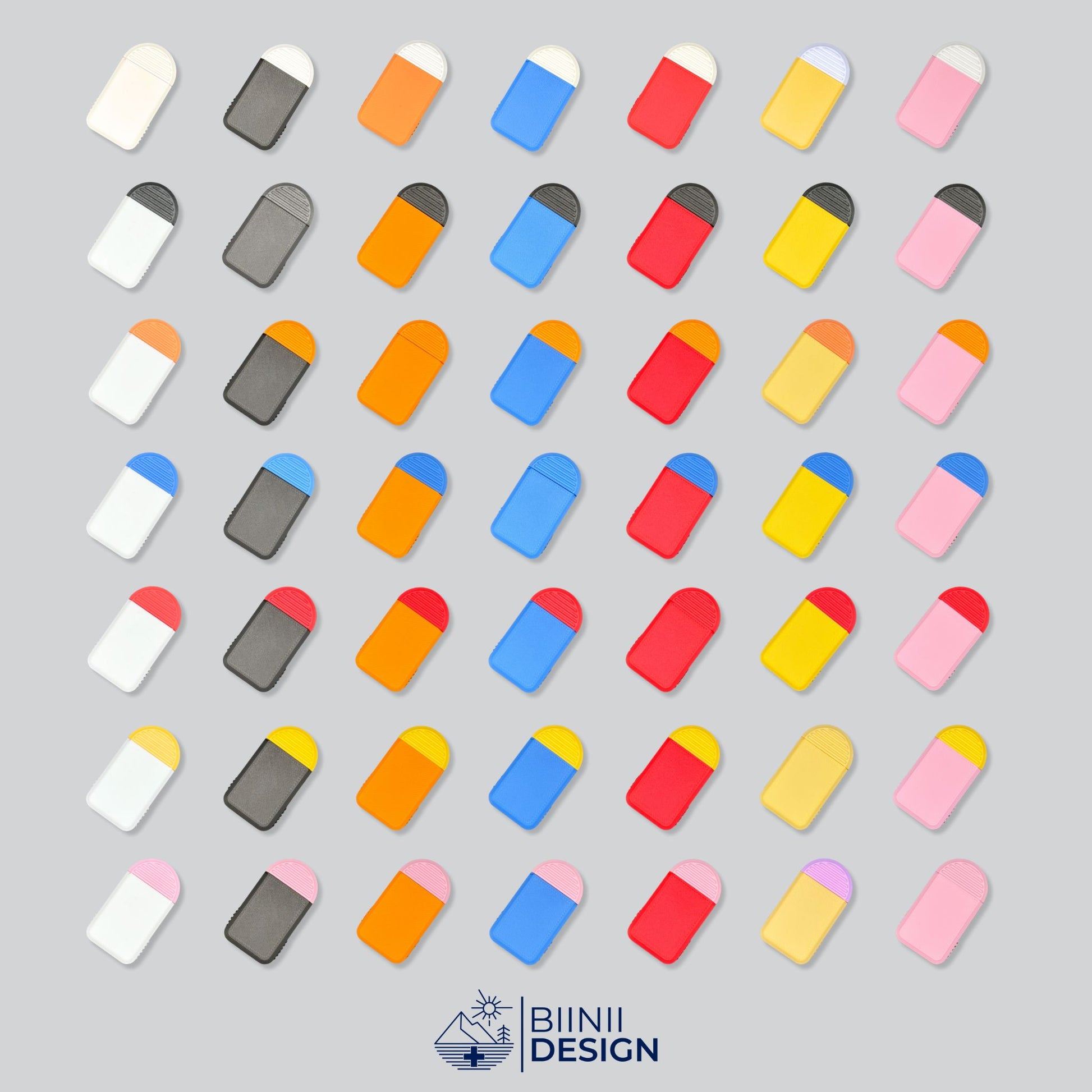 49 Color Combinations of the Compact 2-Compartment Pill Box. Mosaic photo showcasing all available designs. Emphasizes customization and wide selection. Swiss Design by Biinii Design.