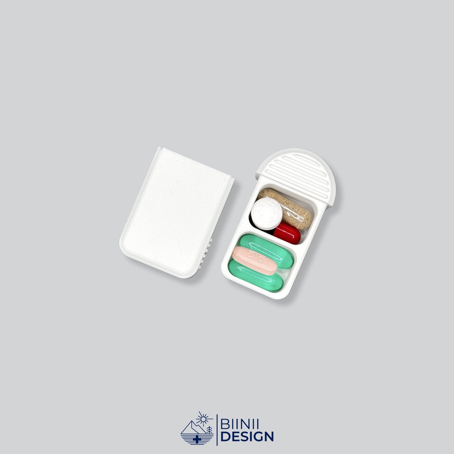 Compact 2-Compartment Pill Box (Monochrome White) opened and filled with various daily medication, vitamins, and supplements. Highlights capacity and versatile usage.