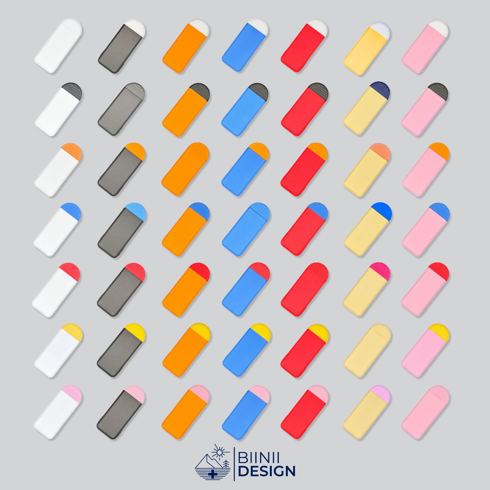 49 Color Combinations of the Compact 3-Compartment Pill Box. Mosaic photo showcasing all available designs. Emphasizes customization and wide selection. Swiss Design by Biinii Design.