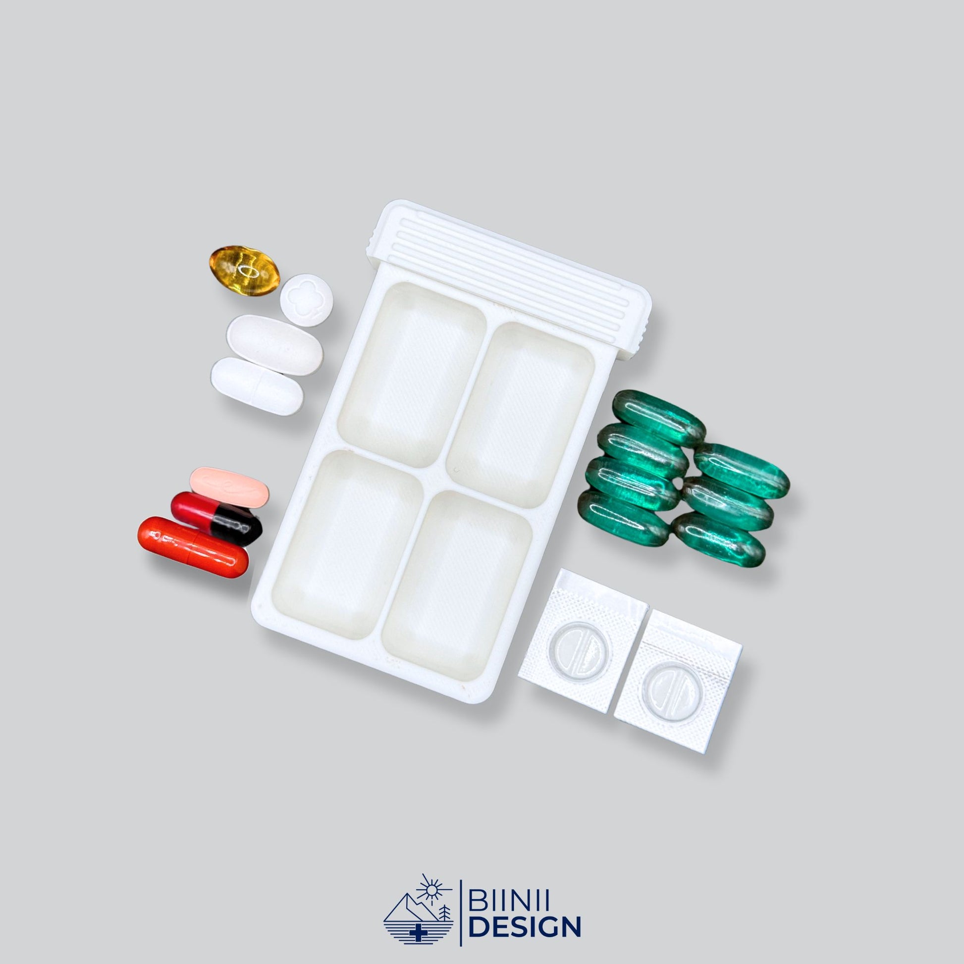 White 4-compartment pill box base with organized layout for tablets, liquid capsules, vitamins, and blister medication, Swiss crafted by Biinii Design.