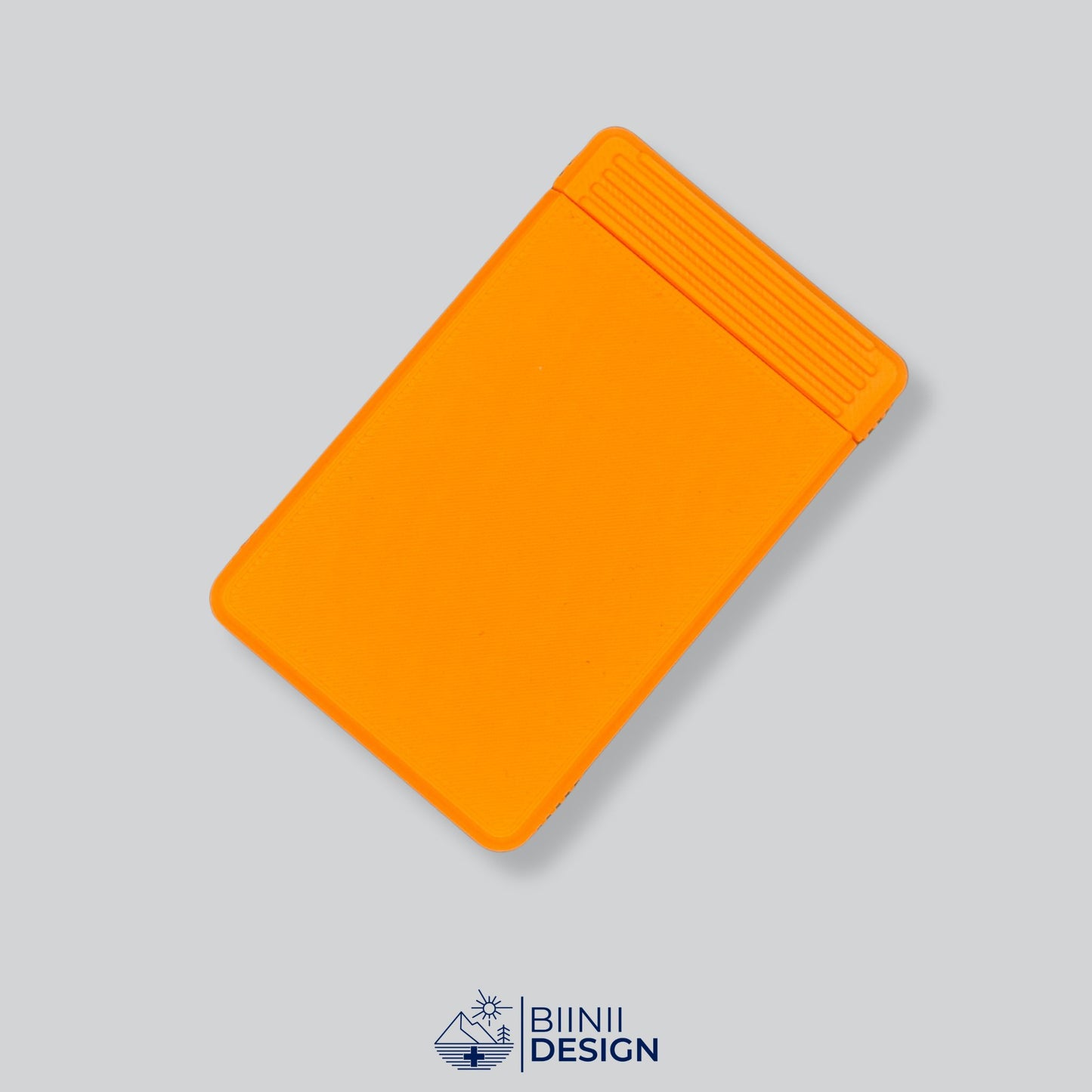 Monochrome orange 7-day pill case finish. Swiss-made daily medication organizer by Biinii Design with Sunday or Monday start.