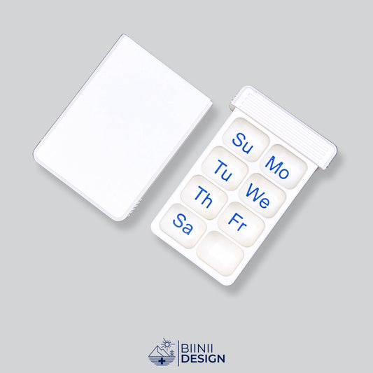 Open compact 7-day pill organizer with Sunday or Monday start. Swiss-made daily medication case by Biinii Design, designed for optimal planning.