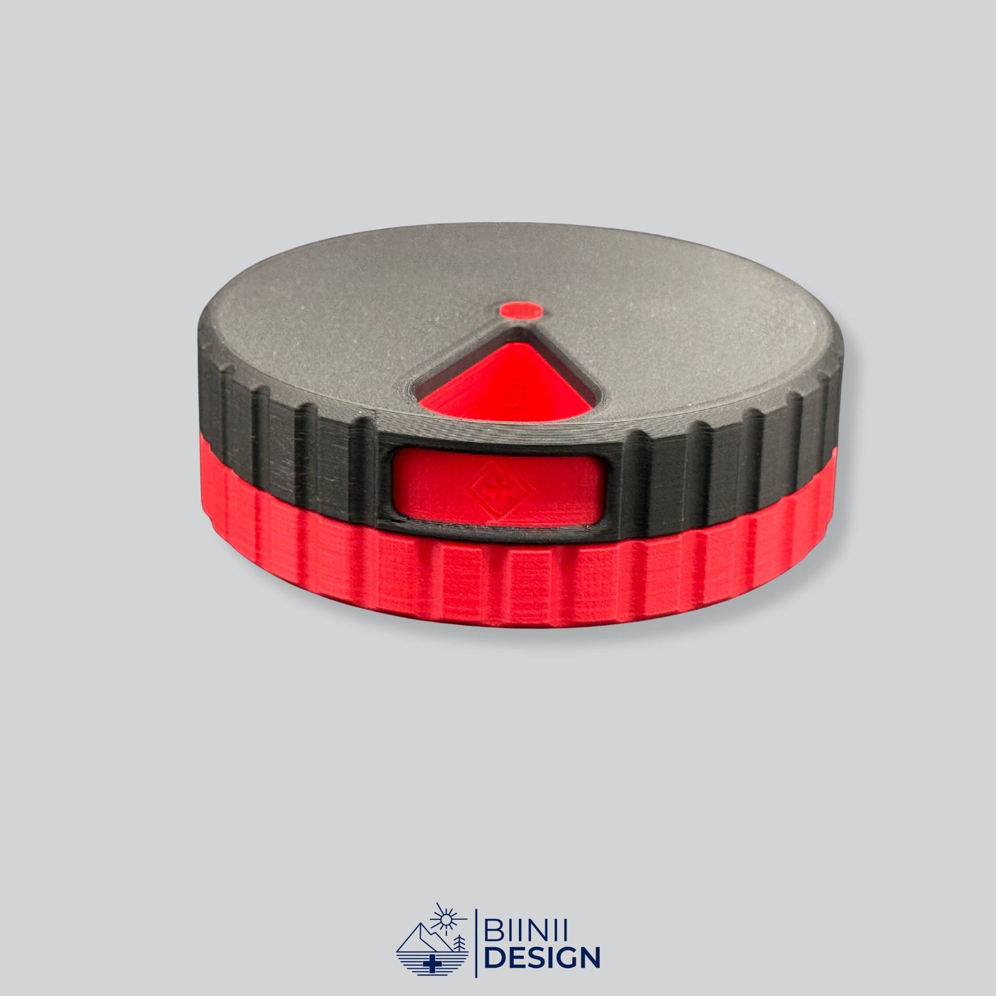Black lid with red base; stylish round magnetic 7-day pill case.