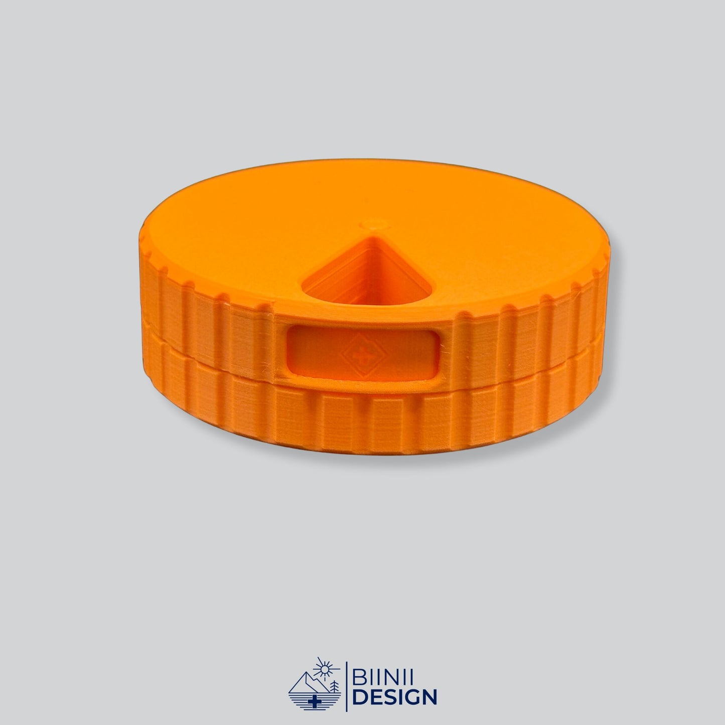 Monochrome orange round magnetic 7-day pill case.