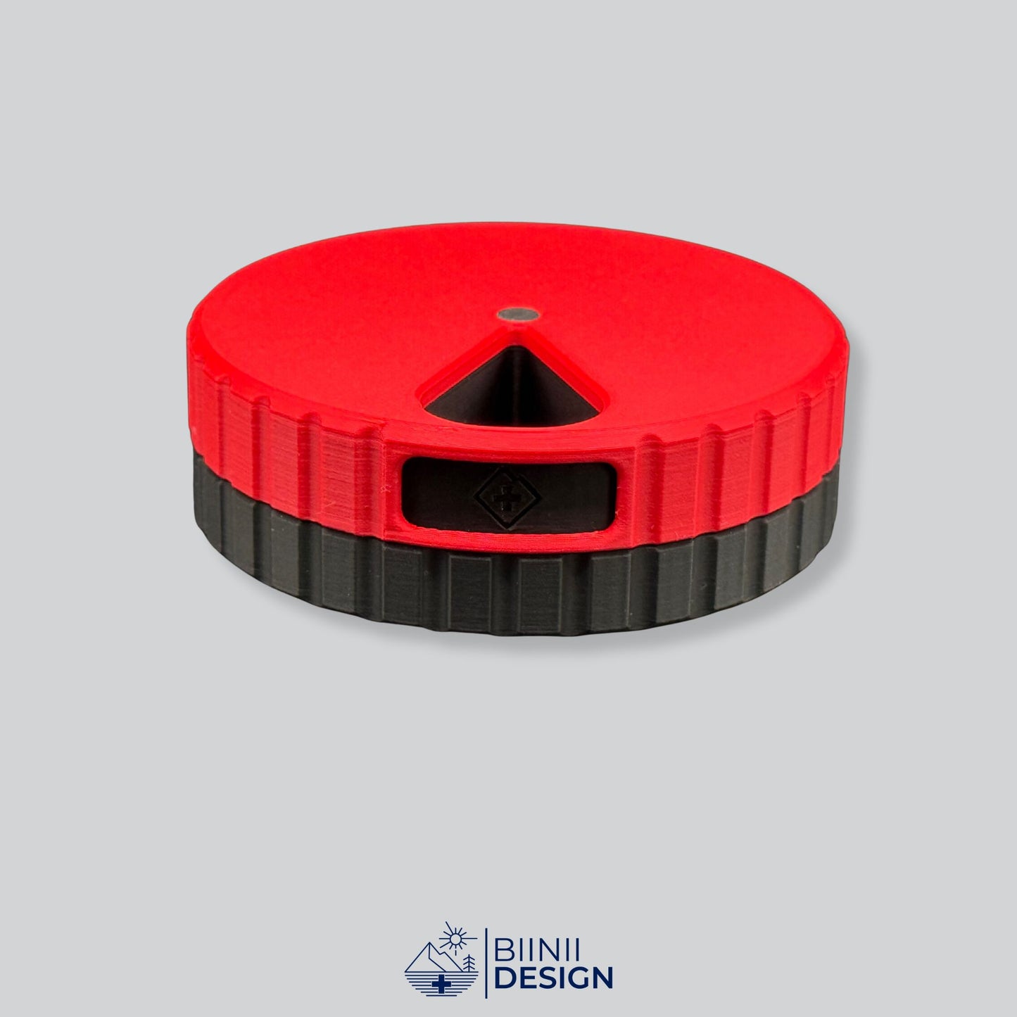 Red lid with black base; magnetic round 7-day pill organizer.