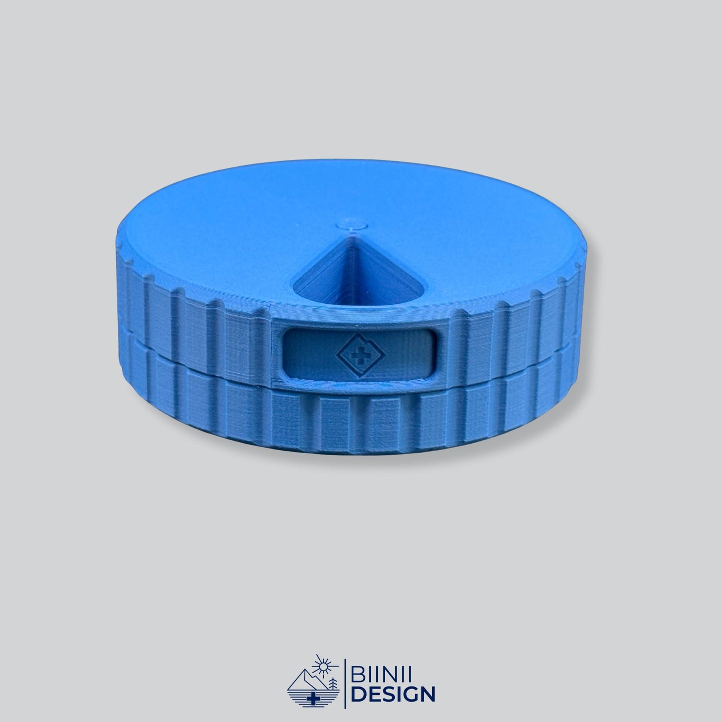 Monochrome blue round magnetic 7-day pill case (Sunday start).