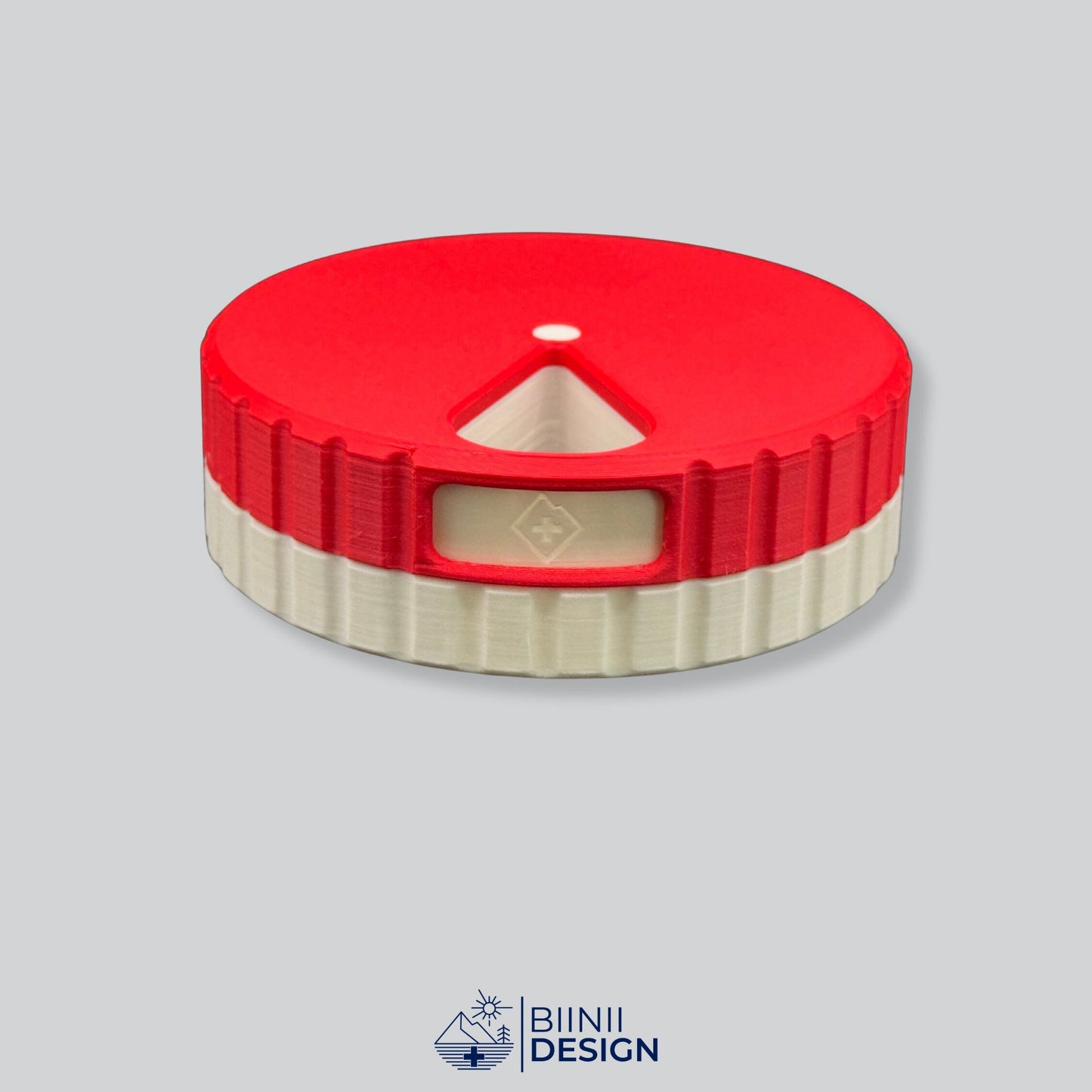 Red lid contrasting with the white base on the round magnetic weekly organizer.