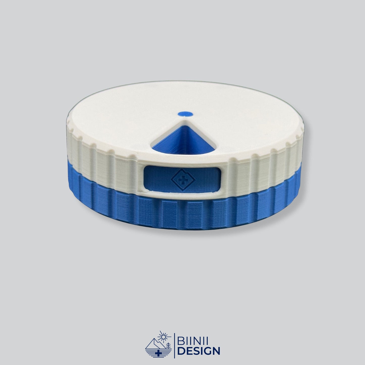 White lid contrasting with the blue base on the round magnetic weekly pill box.