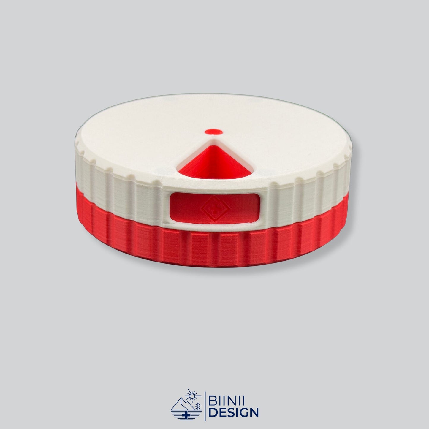 White lid contrasting with the red base on the round magnetic weekly organizer.