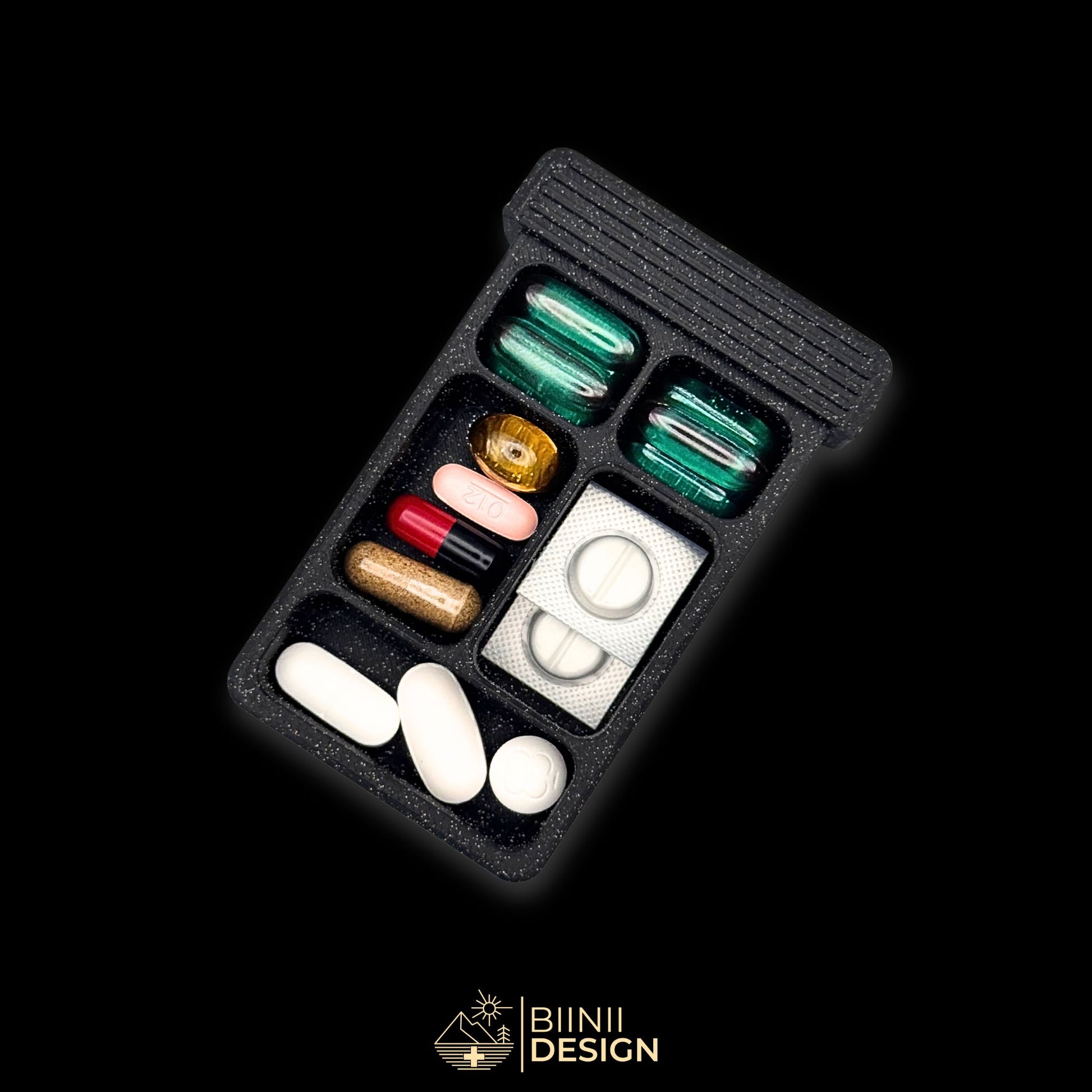 5-compartment tray filled with assorted tablets and capsules. Artistic pill organizer with Sardines theme for weekly or travel use.