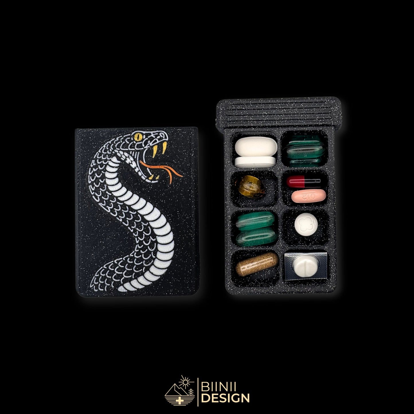 Snake cover beside 8-compartment weekly tray filled. Artistic pill organizer for extended spiritual or supplement plans.