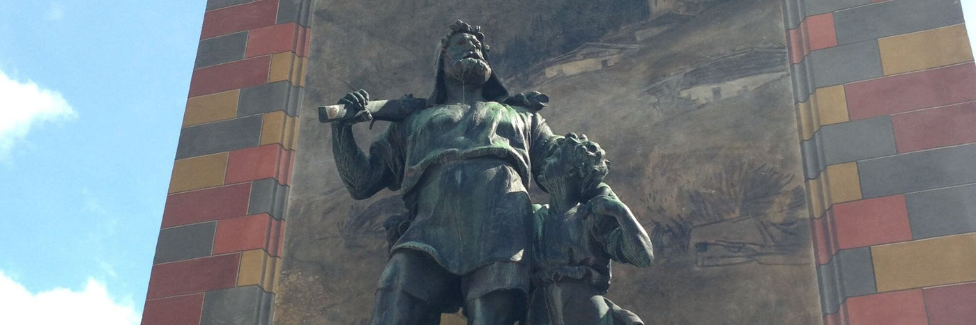 Statue of Wilhelm Tell symbolizing Swiss heritage, craftsmanship, and the transmission of values at the heart of Biinii Design.