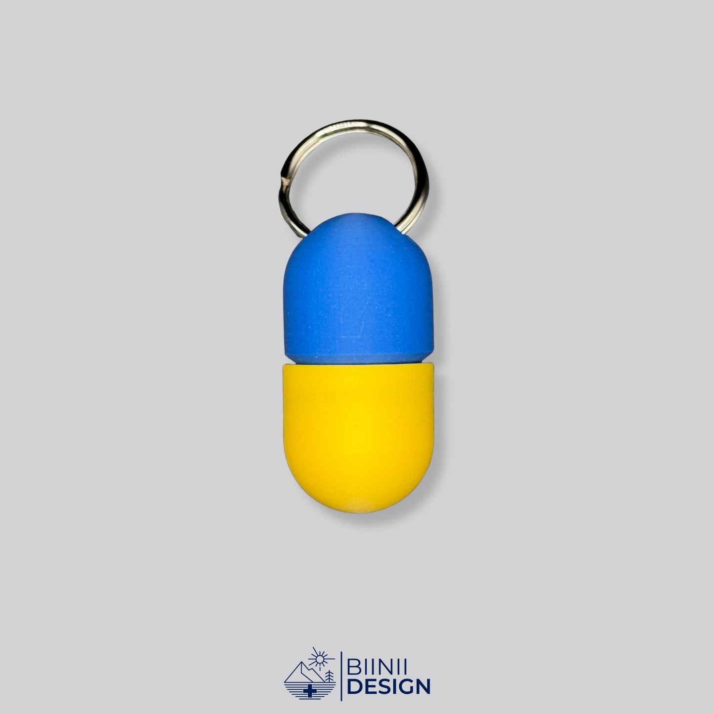 Blue and yellow pillbox with secure screw-top. A compact and colorful keychain organizer for supplements, Lactaid, or pills.
Keywords: yellow pillbox, compact pill case, keyring med container