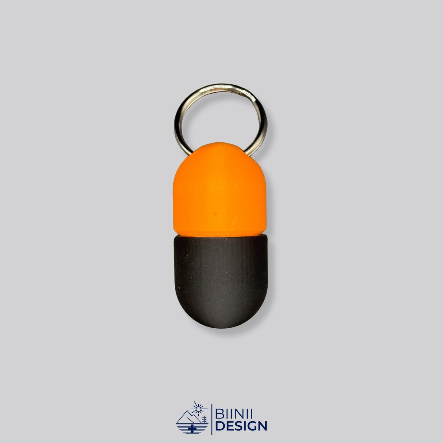 Orange and black keyring pillbox with capsule shape. Secure, colorful, and ideal for vitamins, Lactaid, or emergency pills on the go.
Keywords: bold pill container, keychain pillbox, compact supplement case