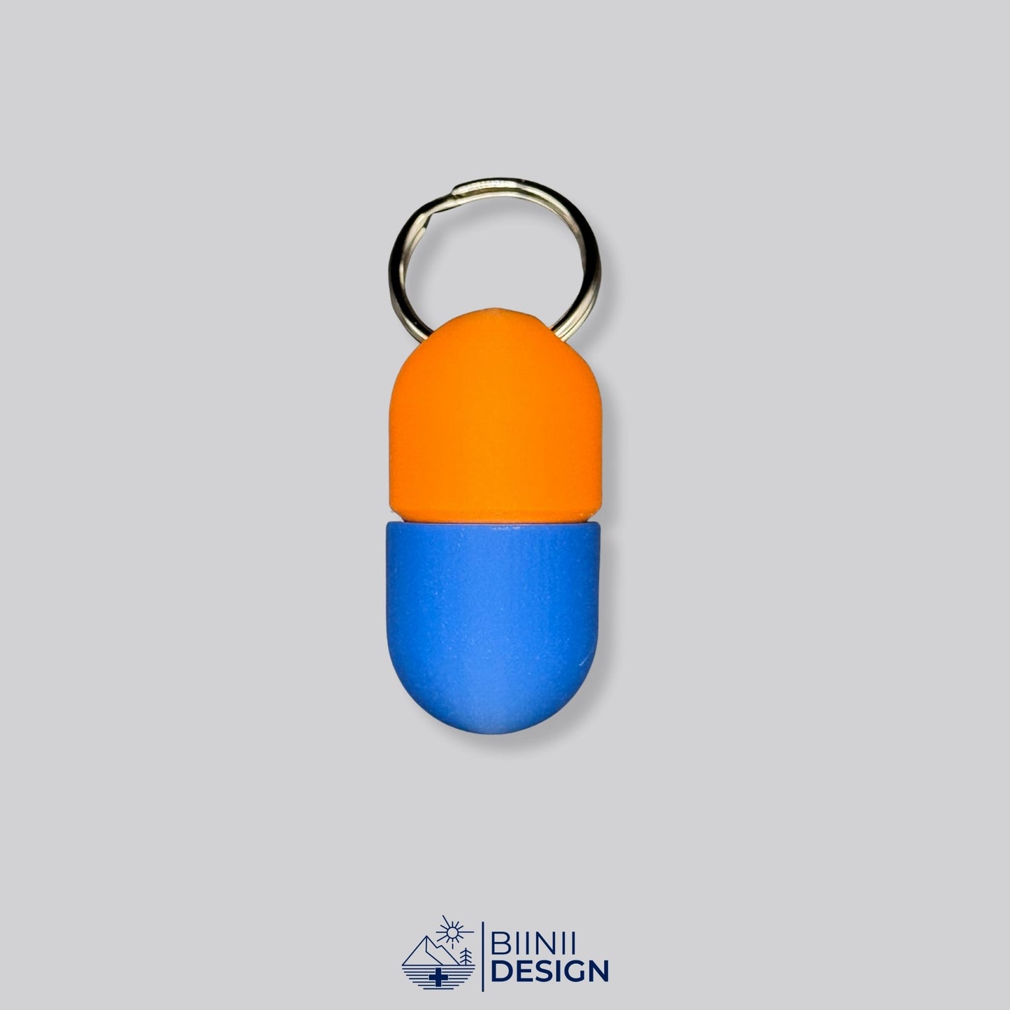 Orange and blue capsule-style pillbox with keyring. Perfect for supplements or daily pills — compact, colorful, and travel-ready.
Keywords: colorful pillbox, daily supplement case, compact pill holder