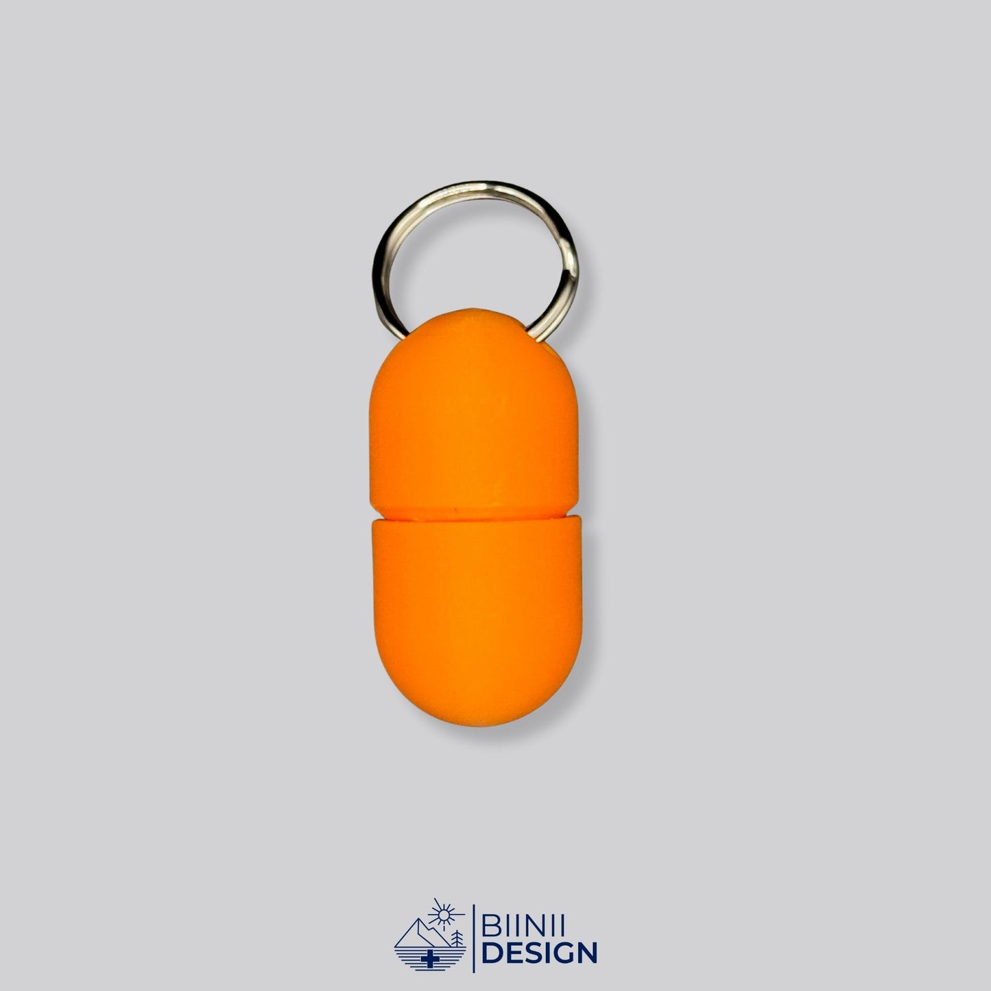 Full orange pillbox with screw-lock design and keychain. A monochrome, minimalist pill holder for travel or daily supplement routines.
Keywords: orange pillbox, minimalist med case, compact keyring holder