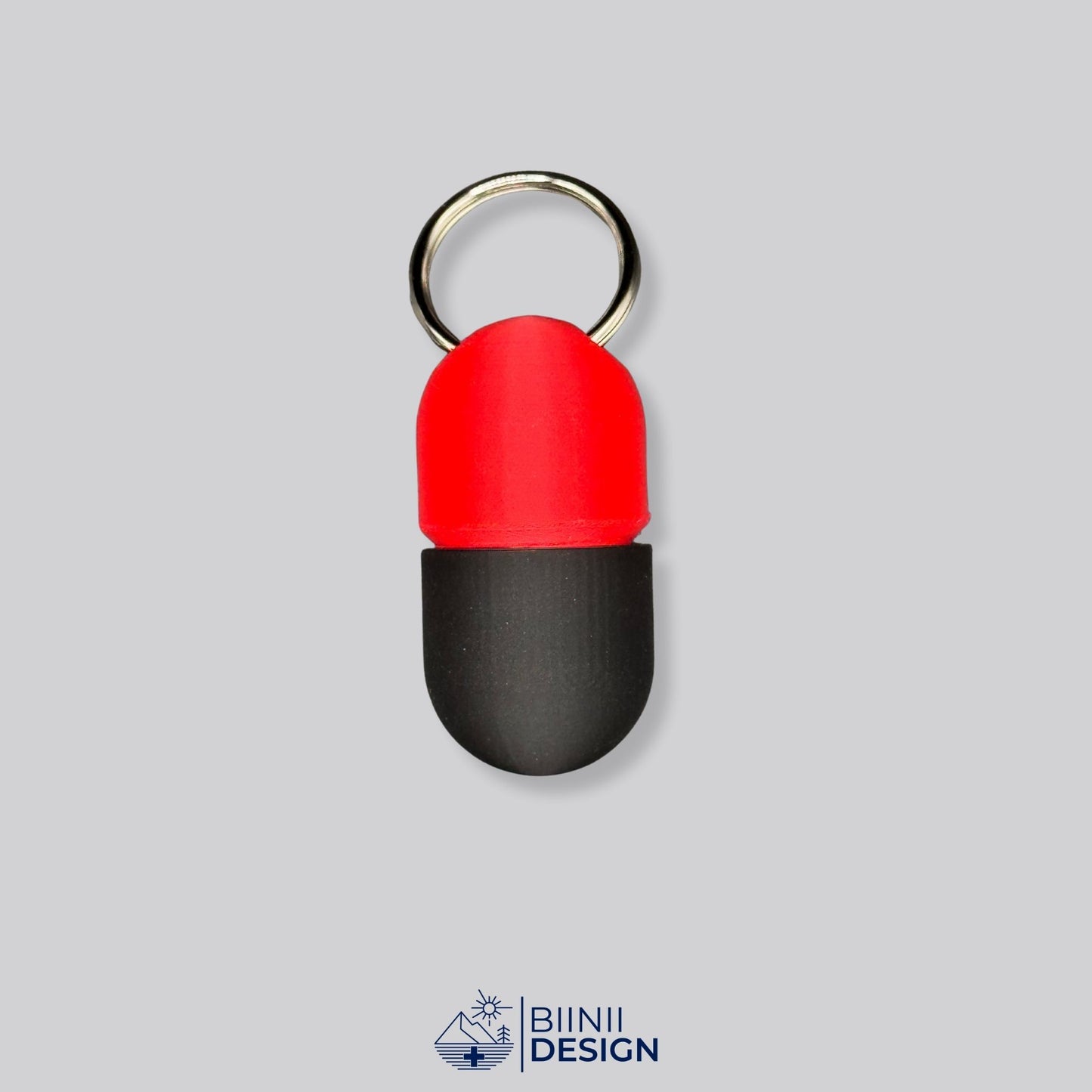 Red and black keyring pillbox with screw-lock closure. Bold, compact solution for carrying vitamins or medication anywhere.
Keywords: black pill container, compact med case, keyring pillbox