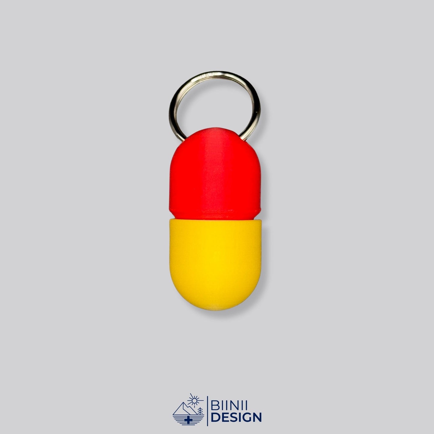 Red and yellow capsule pillbox with keyring — ideal for vitamins, emergency pills, or daily med routines.
Keywords: colorful pillbox, travel med container, keyring pill organizer