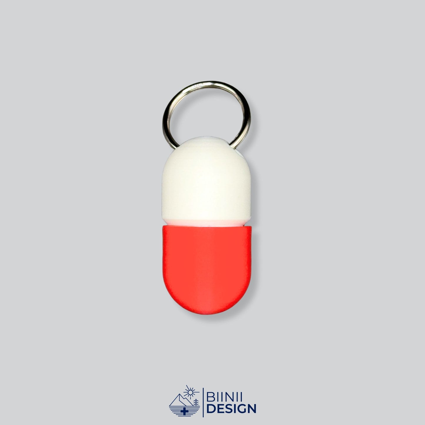 White and red keyring pillbox with capsule form. Perfect for aspirin, Lactaid, or supplements. Lightweight and portable.
Keywords: small pill container, travel pill case, keychain supplement box