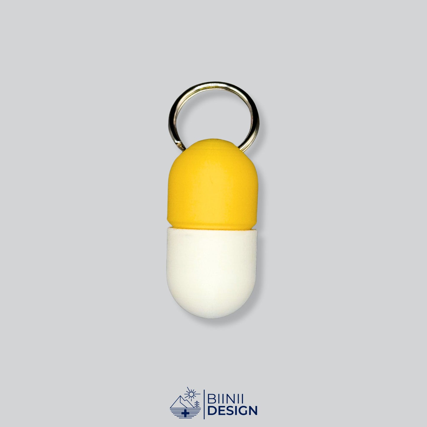 Yellow and white capsule pillbox with screw closure and keyring. A bright and compact way to carry daily vitamins or pills.
Keywords: yellow pillbox, daily supplement case, keyring pill holder