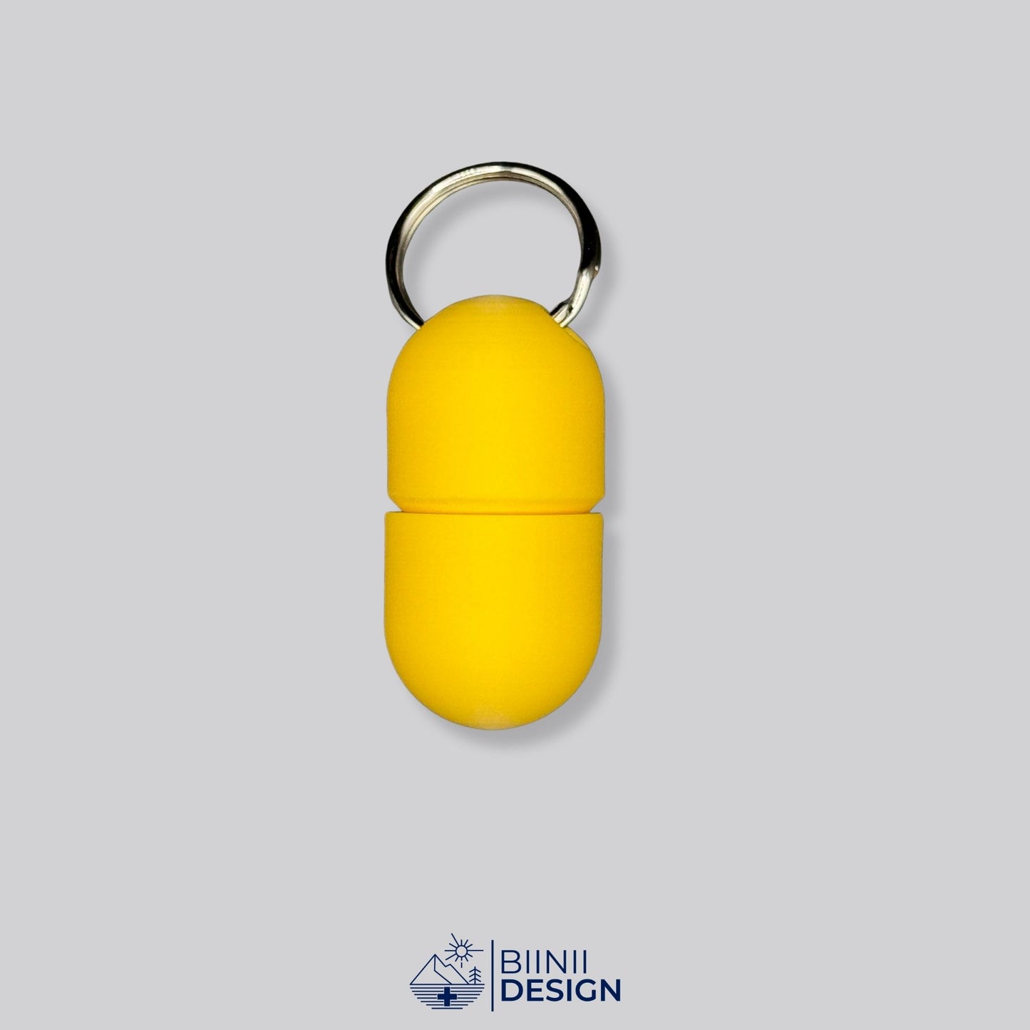 Monochrome yellow capsule pillbox with screw closure and keyring. Minimalist, lightweight, and travel-ready for your supplement routine.
Keywords: yellow pillbox, minimalist med case, compact pill container
