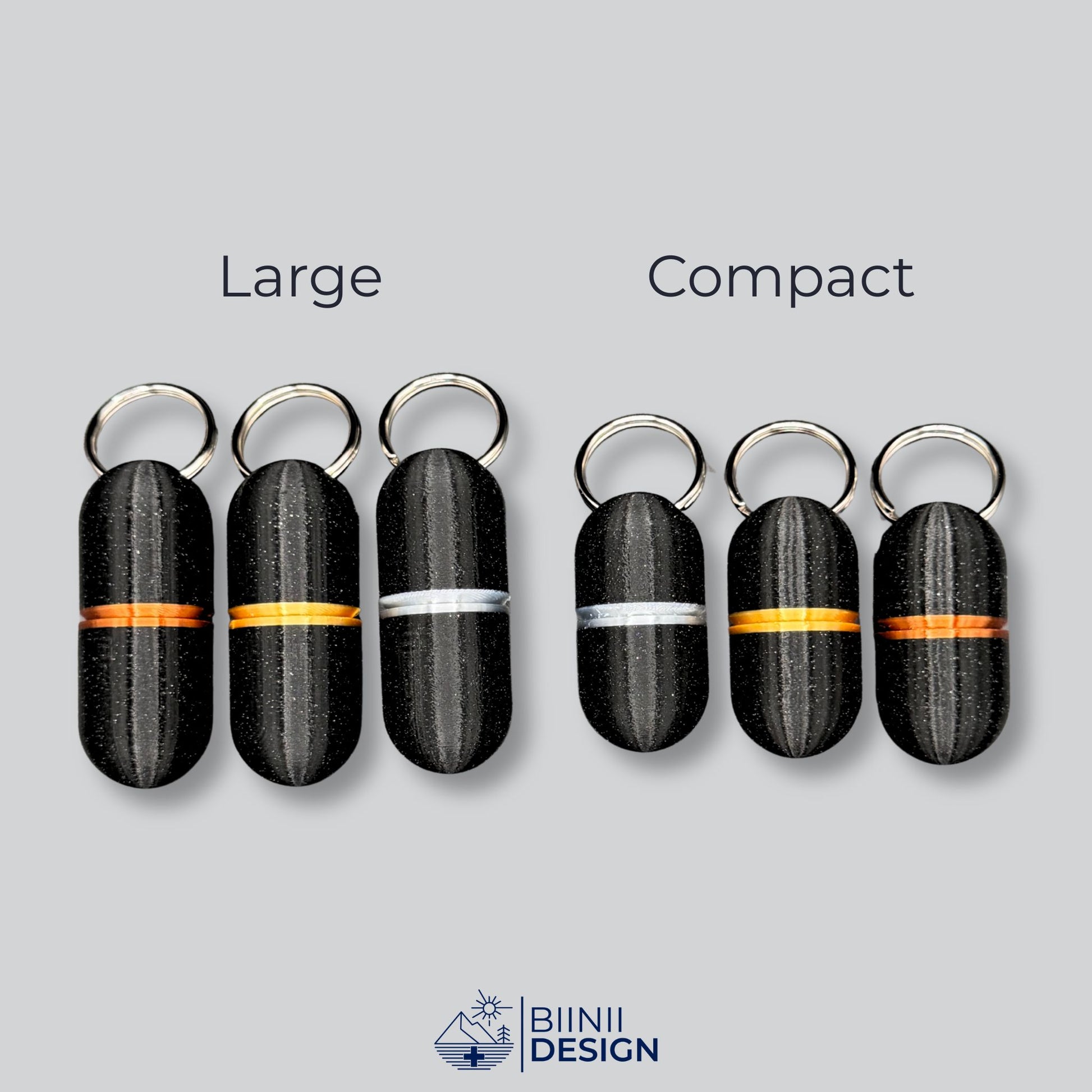 Comparison between large and compact deluxe keyring pillboxes in black galaxy finish with gold, copper, and silver rings. Sleek and practical.
Keywords: deluxe pill organizer, keychain pill case, minimalist pill holder, travel meds container, Biinii Design
