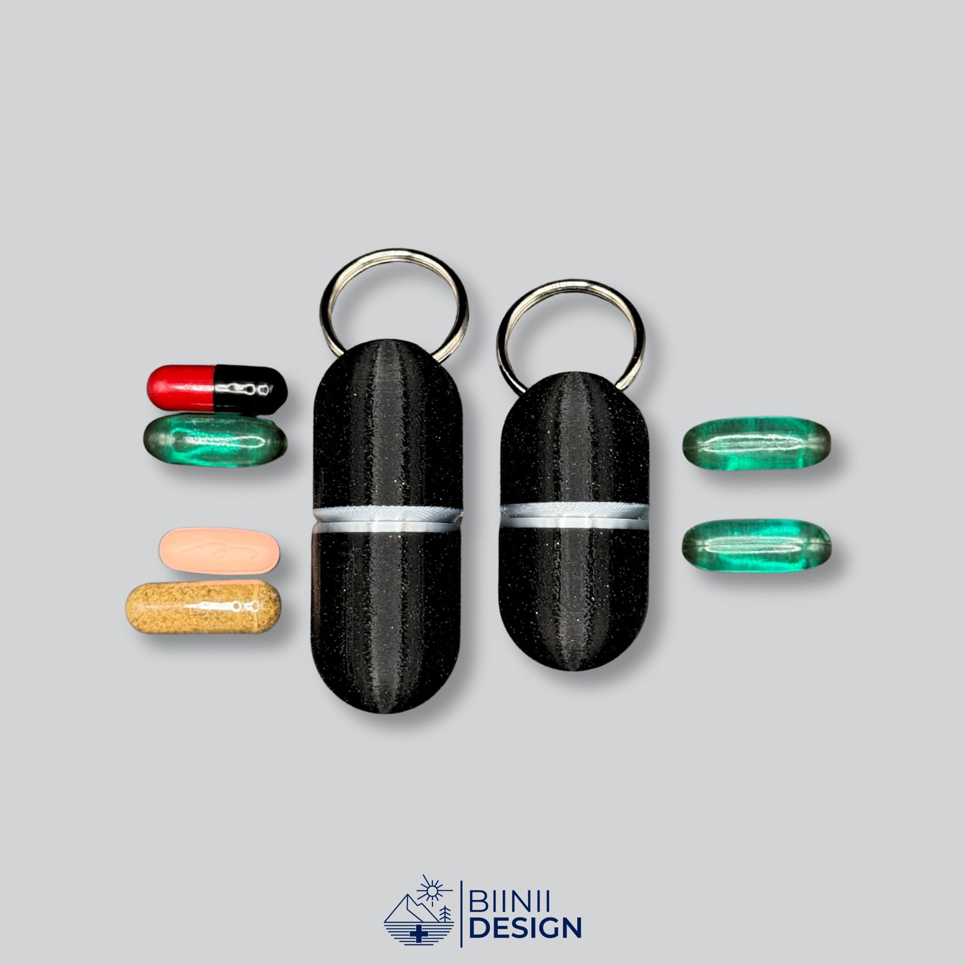 Showcase of pill capacity for deluxe black keyring pillboxes, displaying Liqui-Gels and capsules beside large and compact models.
Keywords: compact pill case, pill holder for supplements, 3D printed pillbox, portable medication storage, Biinii Design