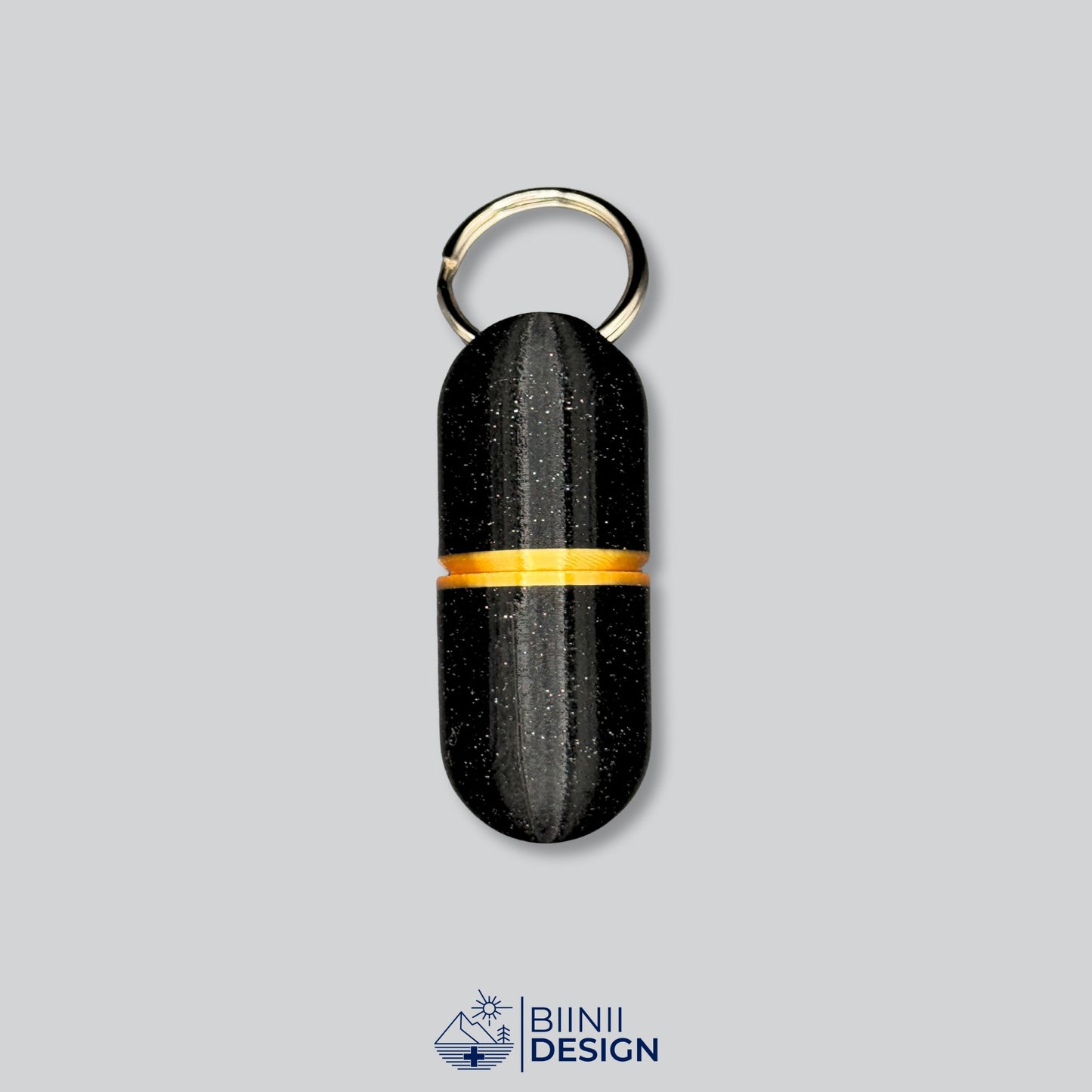 Large deluxe pillbox in galaxy black with gold band, 3D-printed and ready to hold pills, vitamins, or supplements on the go.
Keywords: gold pill holder, deluxe travel pill case, large medication capsule box, Biinii Design