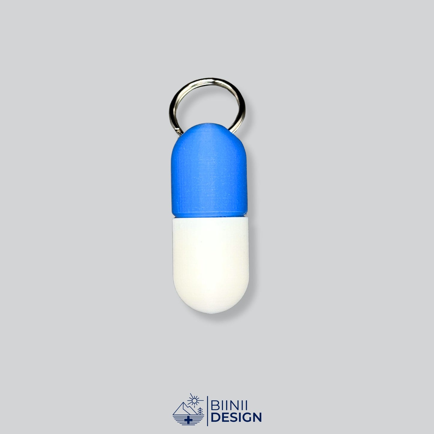 Blue/White large pill organizer with Swiss-made precision. Carry your meds with peace of mind.
Keywords: 3D-printed pillbox, keyring pill holder, travel case