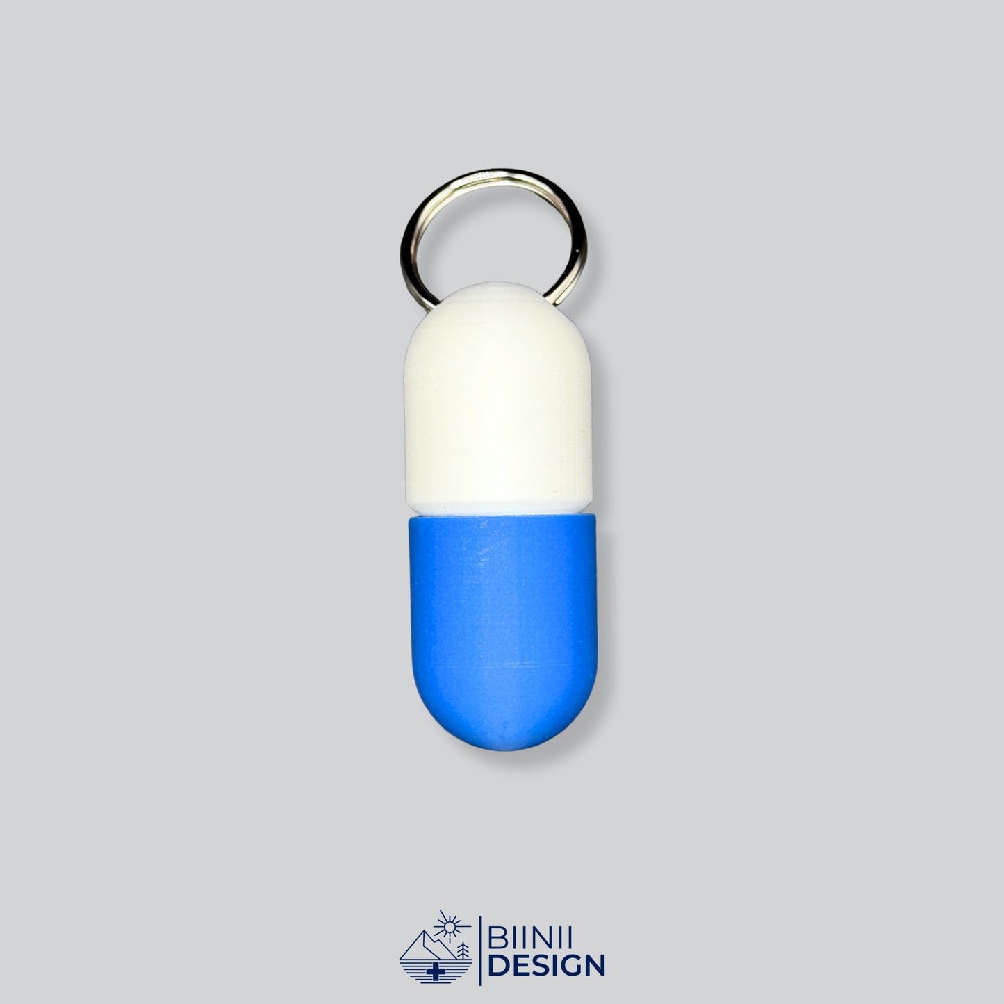 White/Blue keyring pillbox with screw-top closure. Fits 4–5 capsules for travel or emergency meds, with a sleek compact form.
Keywords: travel pill box, daily pill organizer, 3D-printed pillbox
