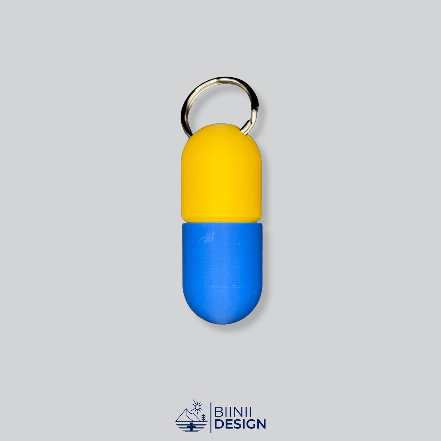 Yellow/Blue pill organizer with striking colors. Ideal for personal care on the move.
Keywords: pillbox keychain, travel pill case, capsule holder