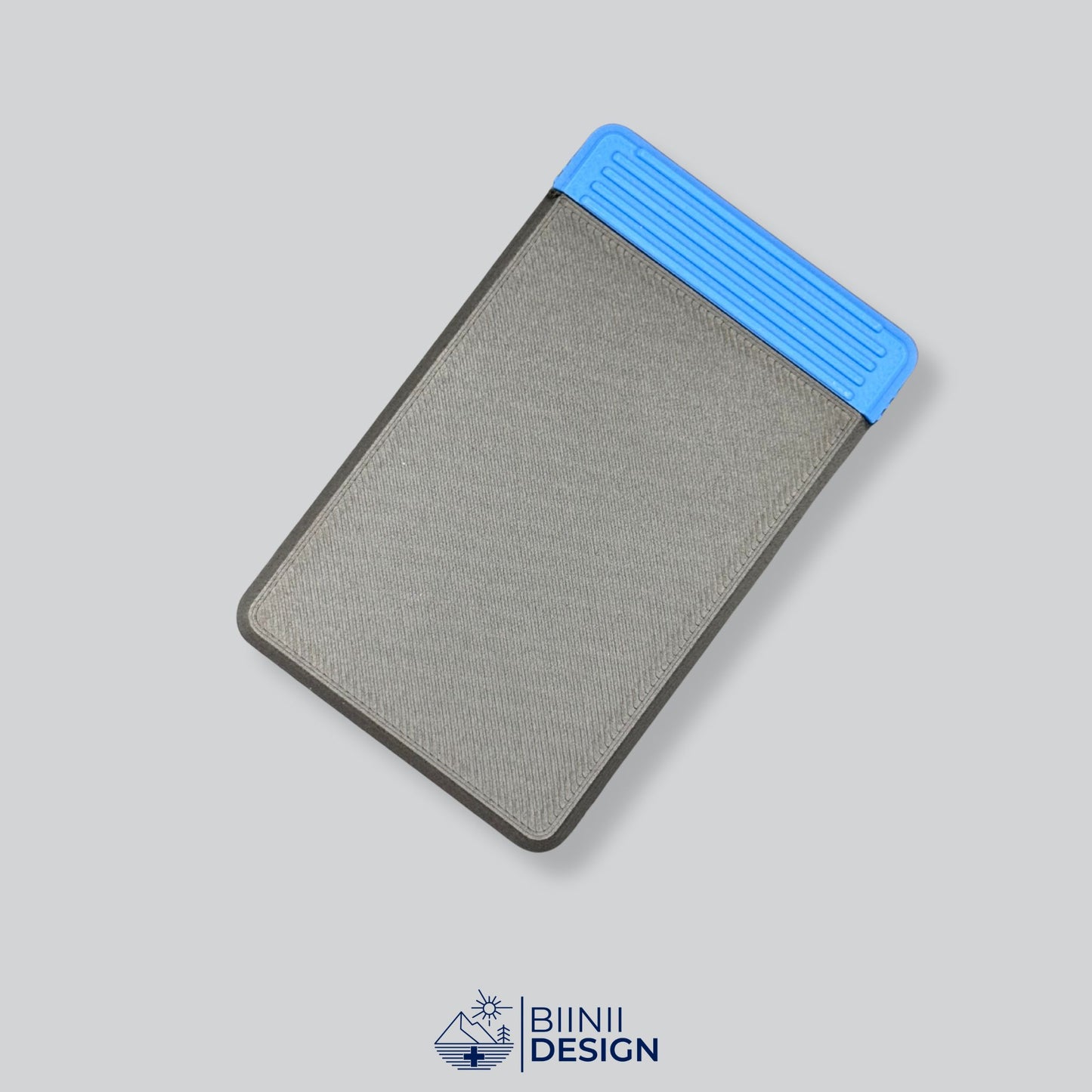 Black/Blue two-tone durable 4-compartment pill organizer designed for complex medication plans. Designed and printed in Switzerland.