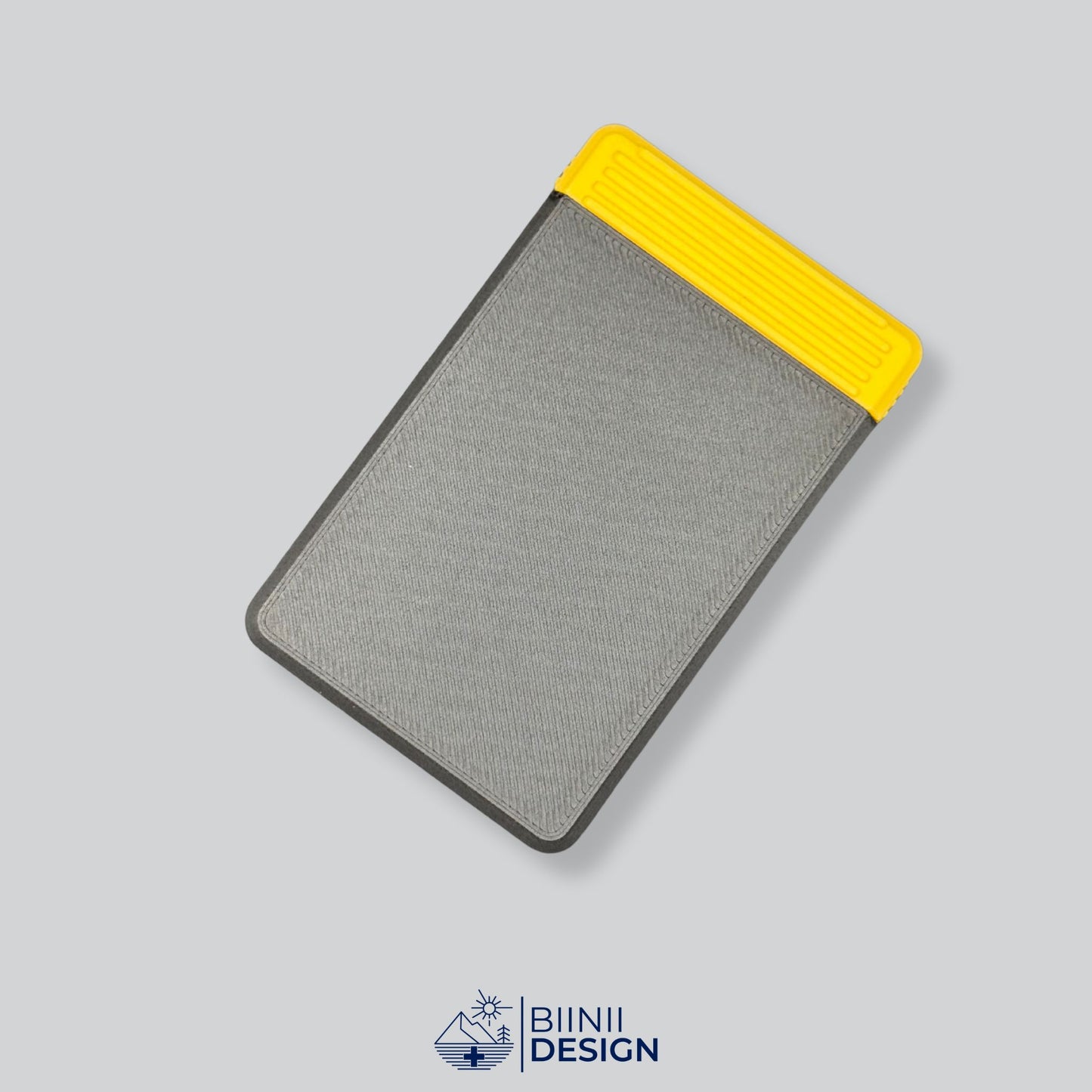 Black/Yellow two-tone durable 4-compartment pill organizer, ideal for complex medication plans and presented as a Designed in Switzerland Biinii Design piece.