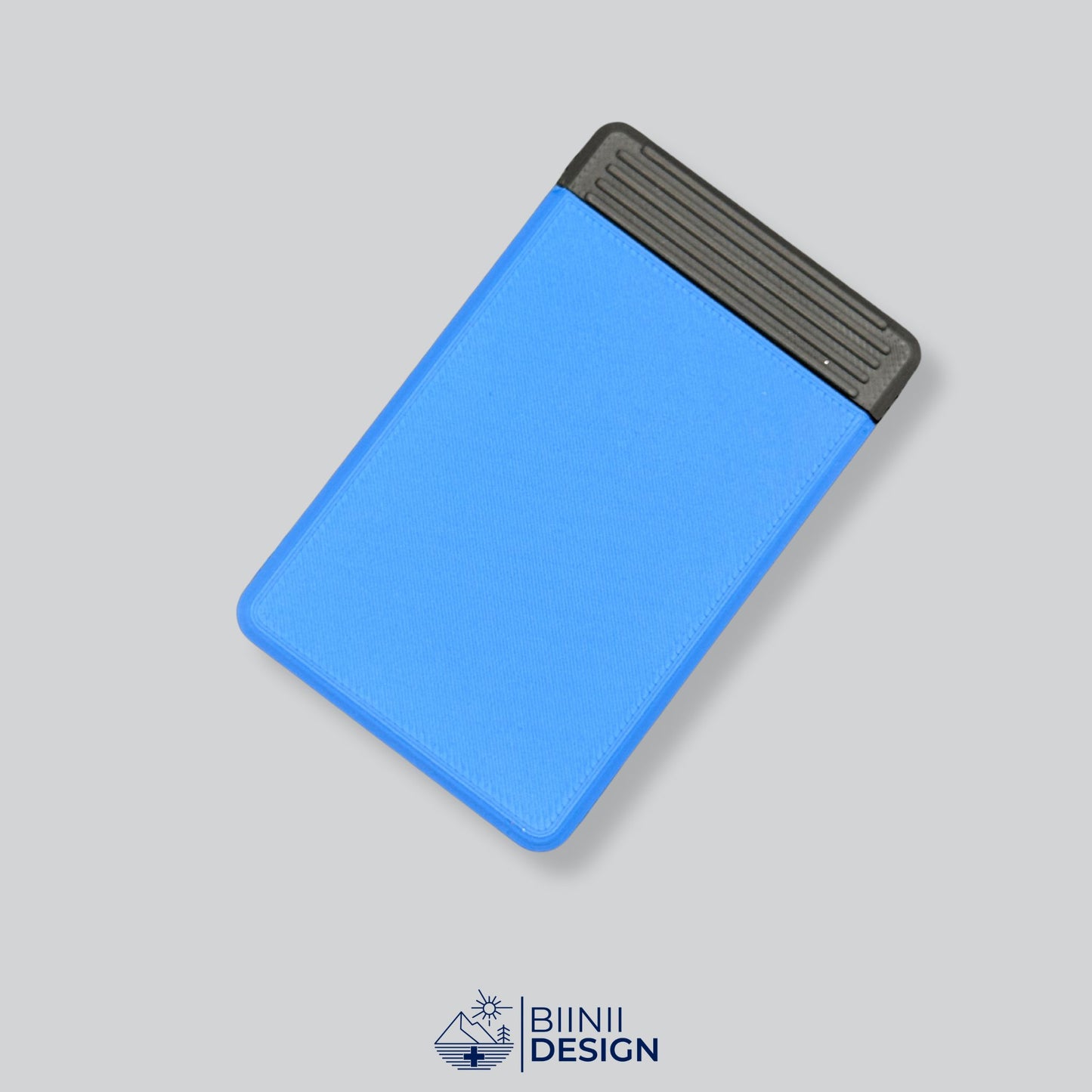 Blue/Black two-tone premium 4-compartment pill case, ideal for daily medication and presented as a Swiss-crafted Biinii Design piece.