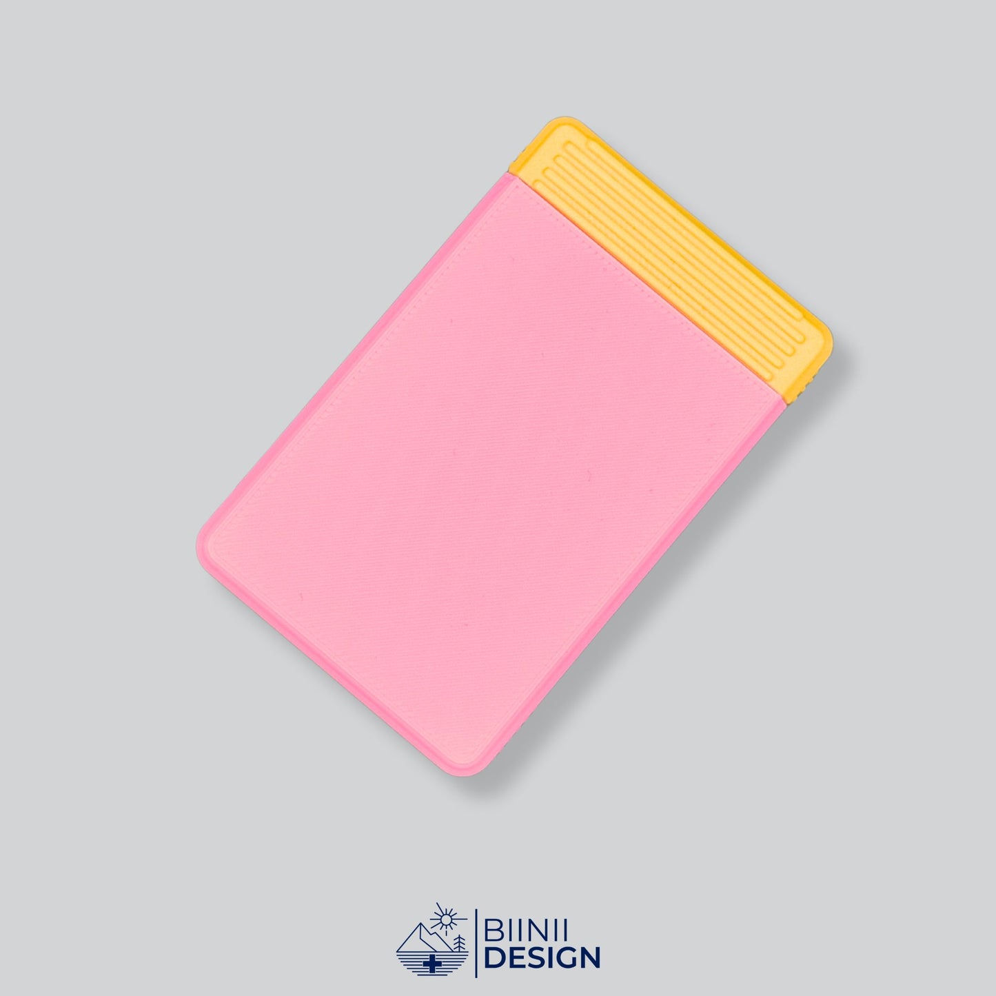 Pink/Yellow two-tone minimalist travel pill organizer from our 49-color collection, designed for daily medication. A Swiss-made Biinii Design original.