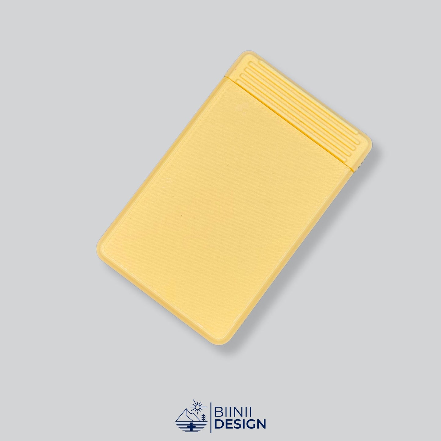 A functional Yellow monochrome precision-crafted pill holder, perfect for long-term treatments, a Swiss-made Biinii Design piece.