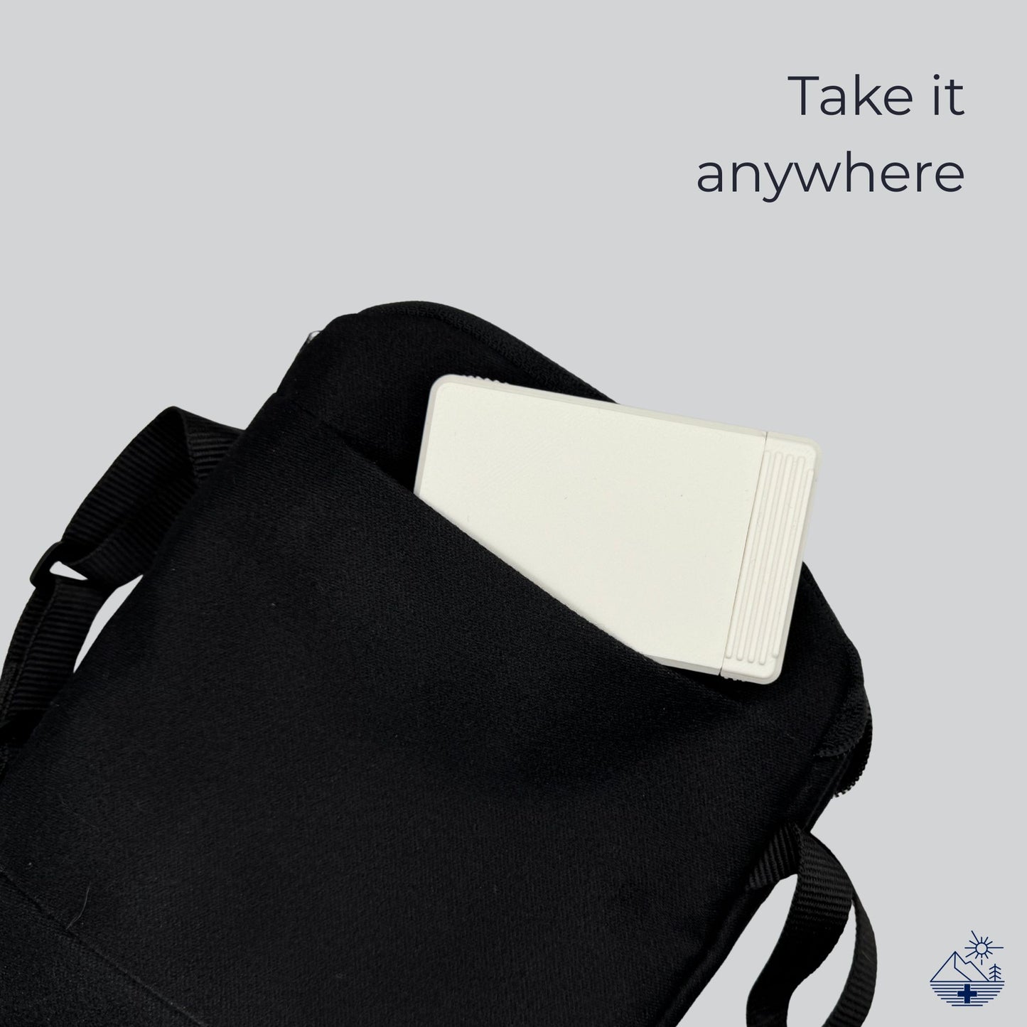 White monochrome travel pill box tucked into a pouch. Swiss-made compact pill organizer by Biinii Design, minimalist design.