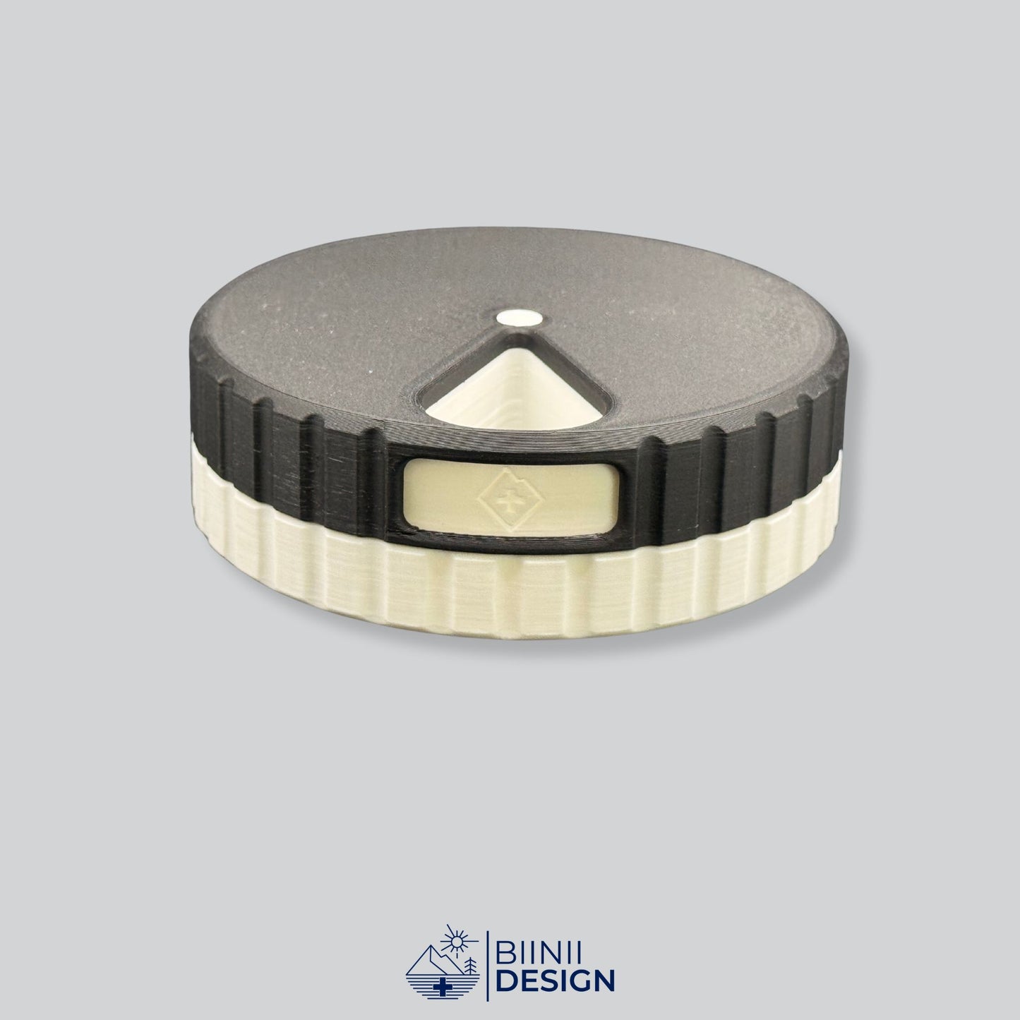 Black lid contrasting with the crisp white base on the round magnetic pill organizer.