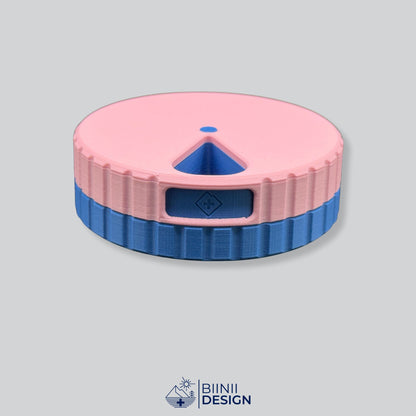 Round magnetic 7-day pill organizer with a pink lid and a blue base, Sunday or Monday start.