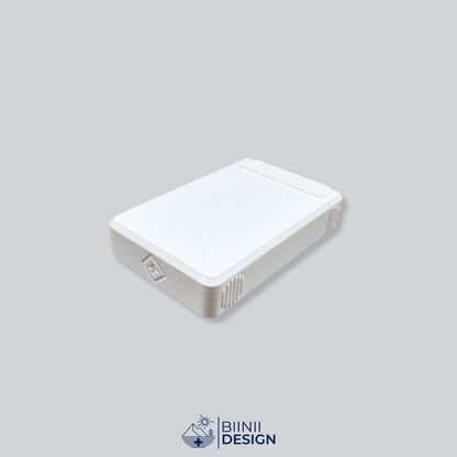 Closed eight-compartment travel pill box seen at an angle, a flat double-row case.