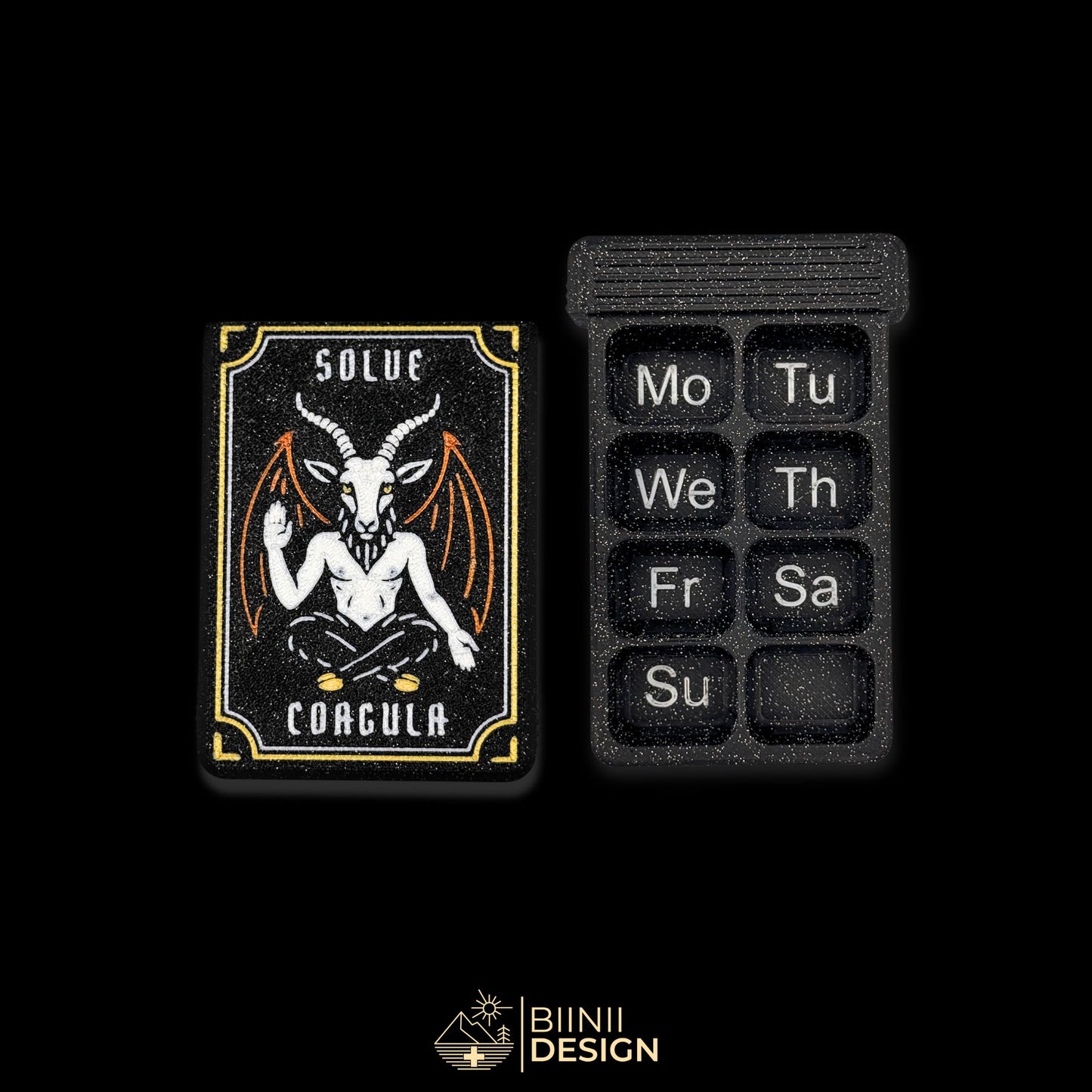 Baphomet cover next to empty 8 cpt tray (EN Monday start). Weekly artistic pill organizer option for English speakers.