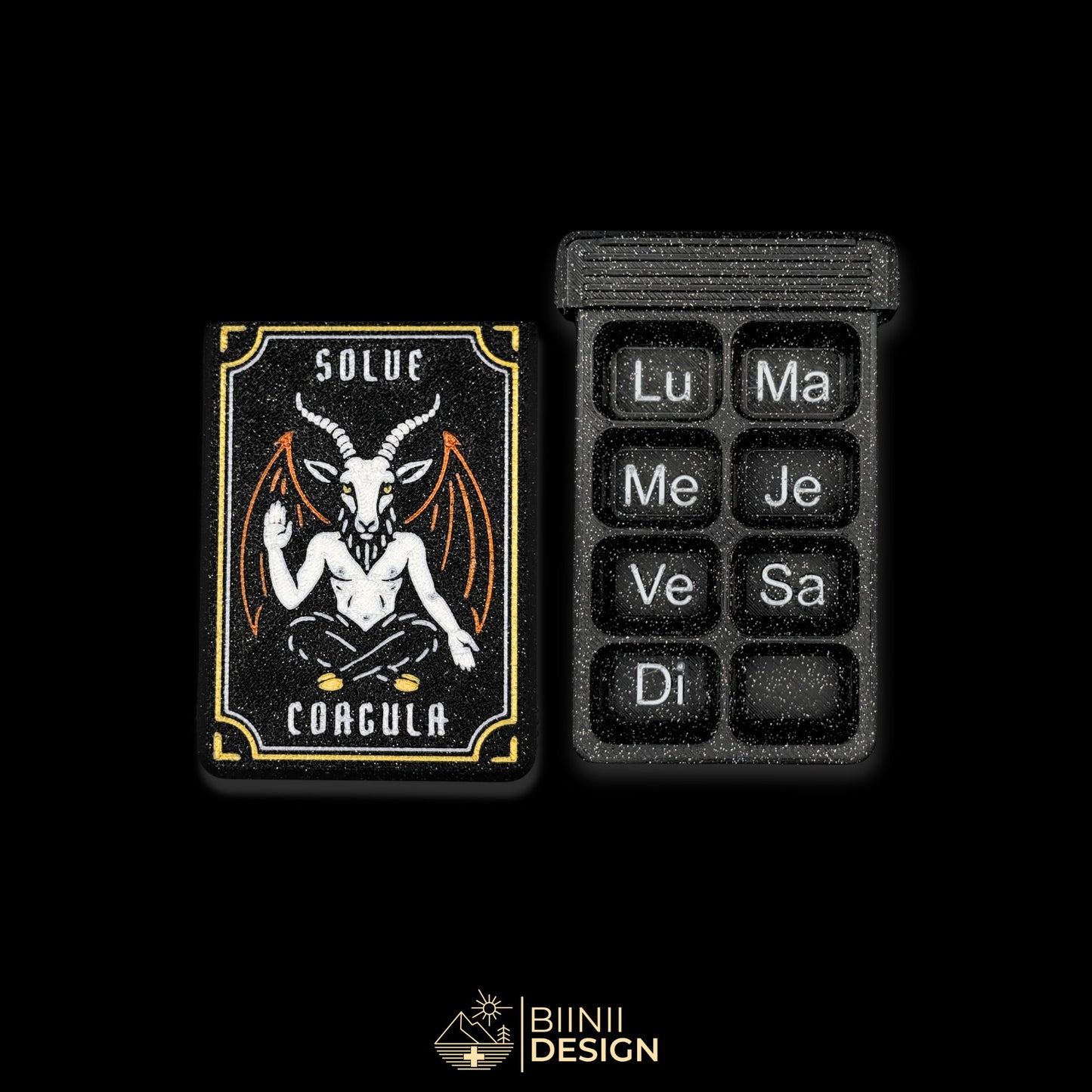 Baphomet cover next to empty 8 cpt tray (FR days). Weekly artistic pill organizer option for French market.