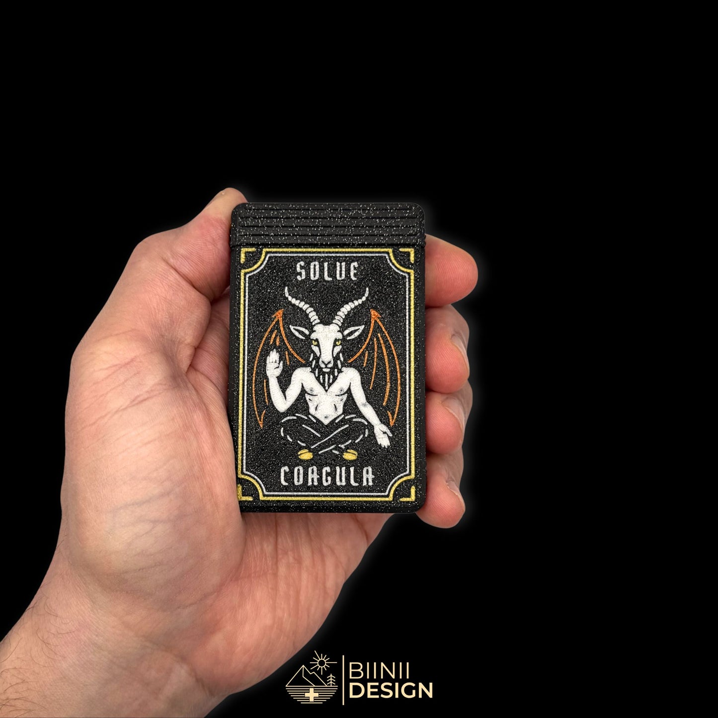 Baphomet pill organizer in hand. Compact symbolic design by Biinii Design.