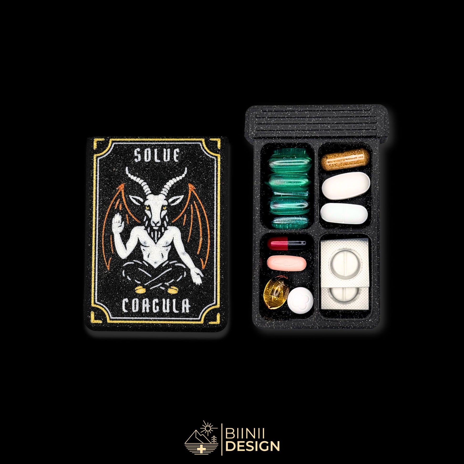 Baphomet cover next to 4 cpt tray. Filled with assorted supplements. Unique symbolic themed pill box.