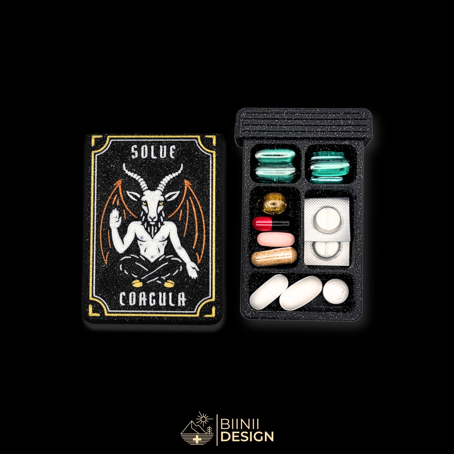 Baphomet cover next to 5 cpt tray. Filled with capsules. Versatile compact daily pill case.